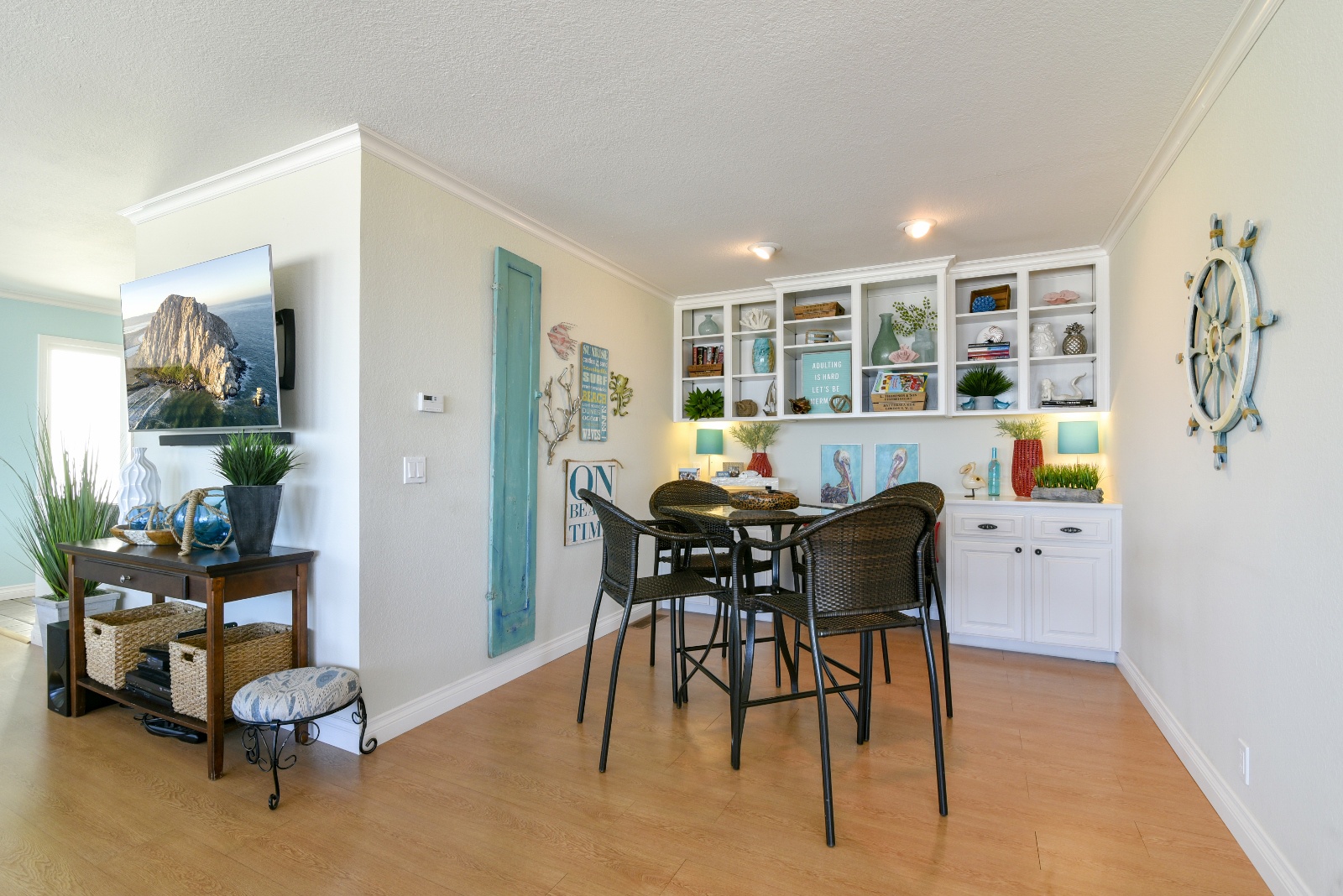 A cozy breakfast nook sits between the living room and kitchen/dining area. Perfect for games or your morning coffee