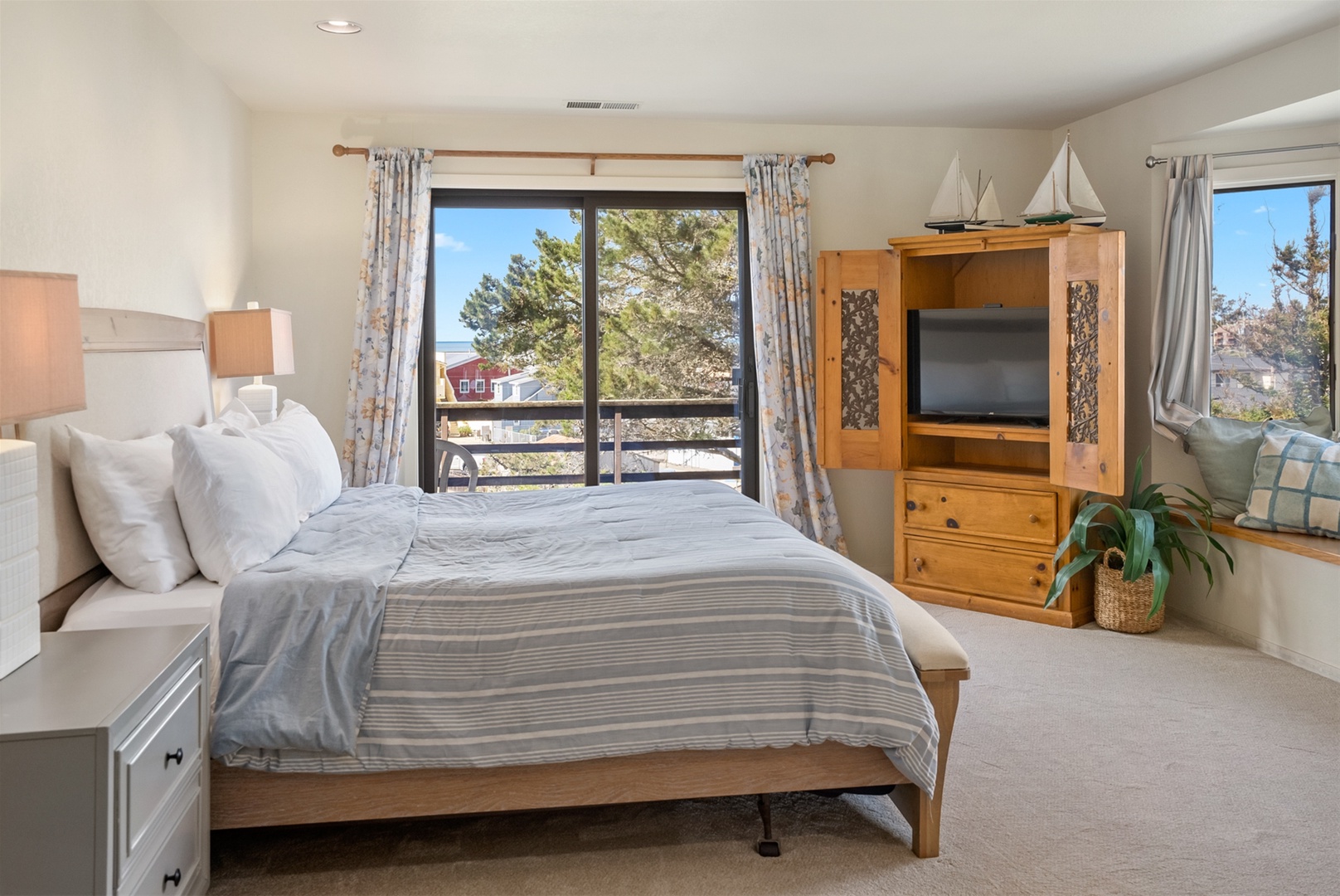Master bedroom window seat, and TV located in the armoire. 