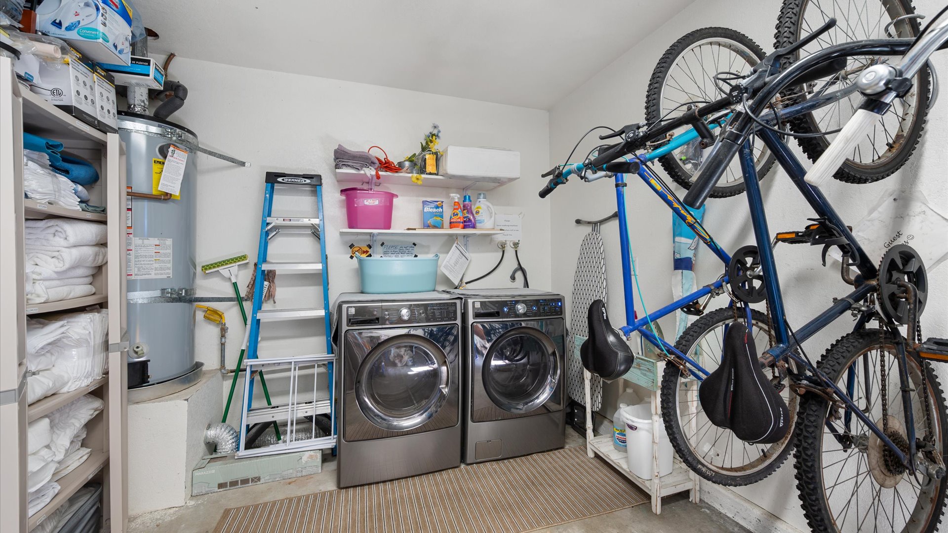 Washer and Dryer for guest use located in the garage, along with 2 bikes