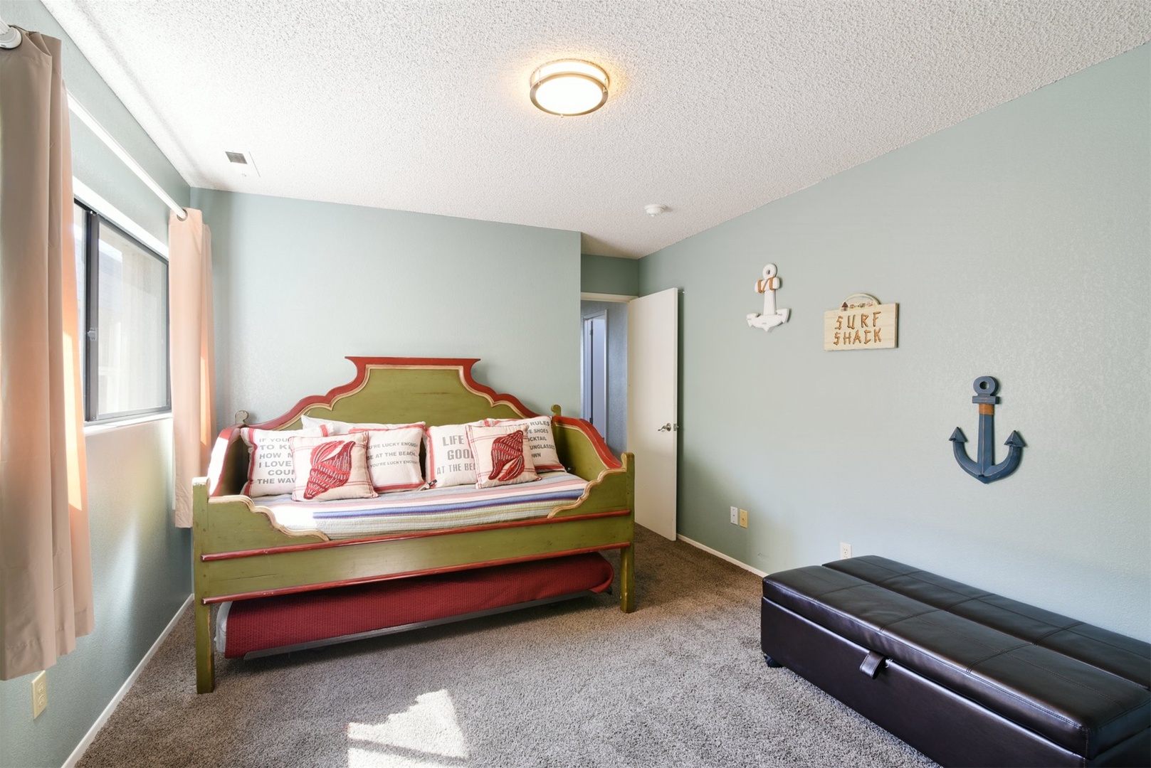 The third bedroom has a twin trundle with 2 twins and a folding twin from the ottoman