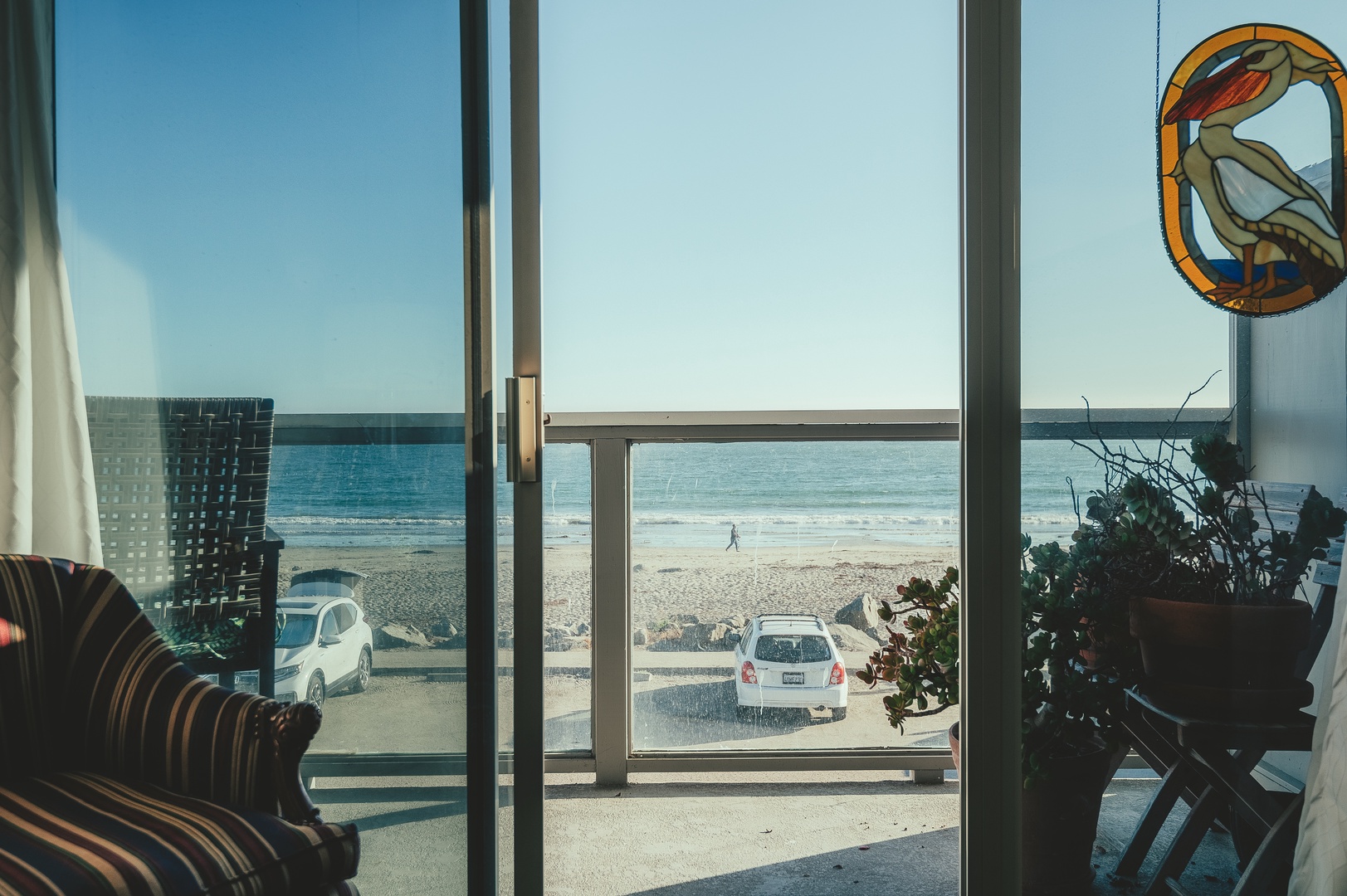 Wake up to stunning ocean views through floor-to-ceiling windows, where the beach stretches endlessly before you.