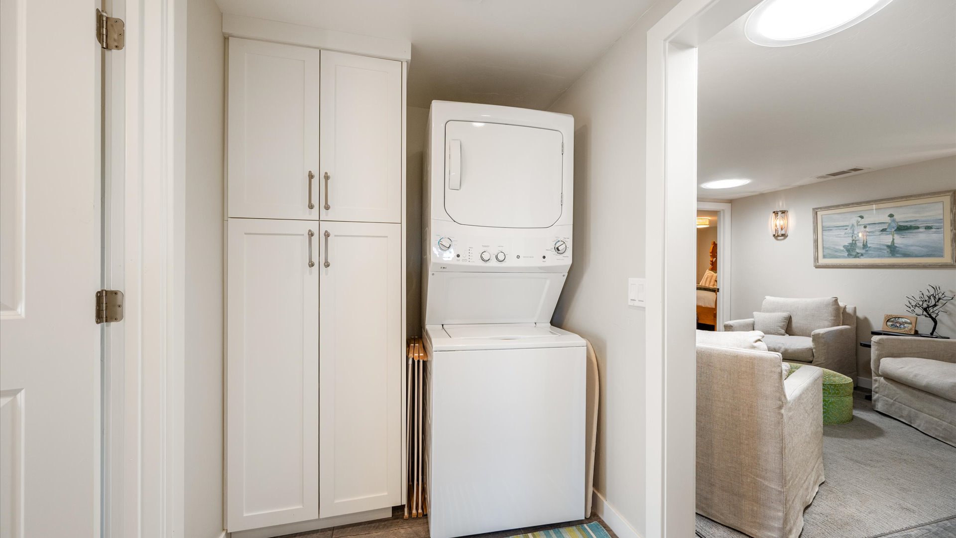 washer and dryer located off the downstairs central living space
