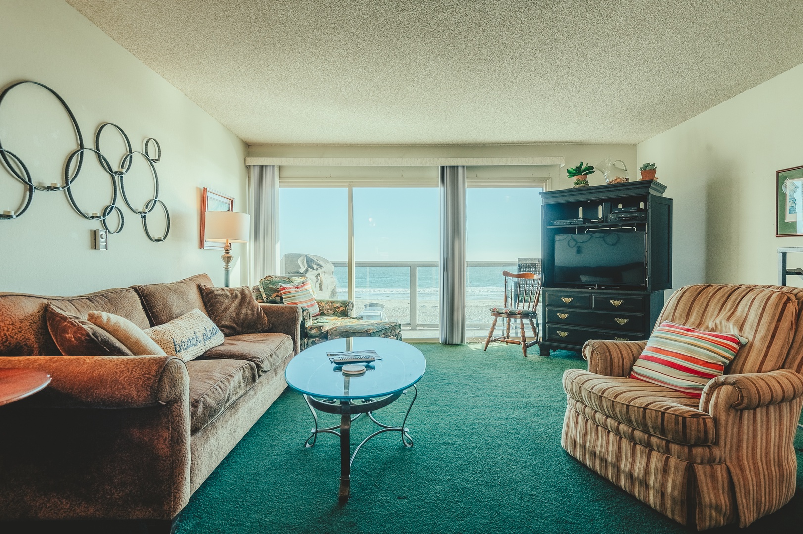 Sink into plush seating while enjoying stunning ocean views in your comfortable living space.