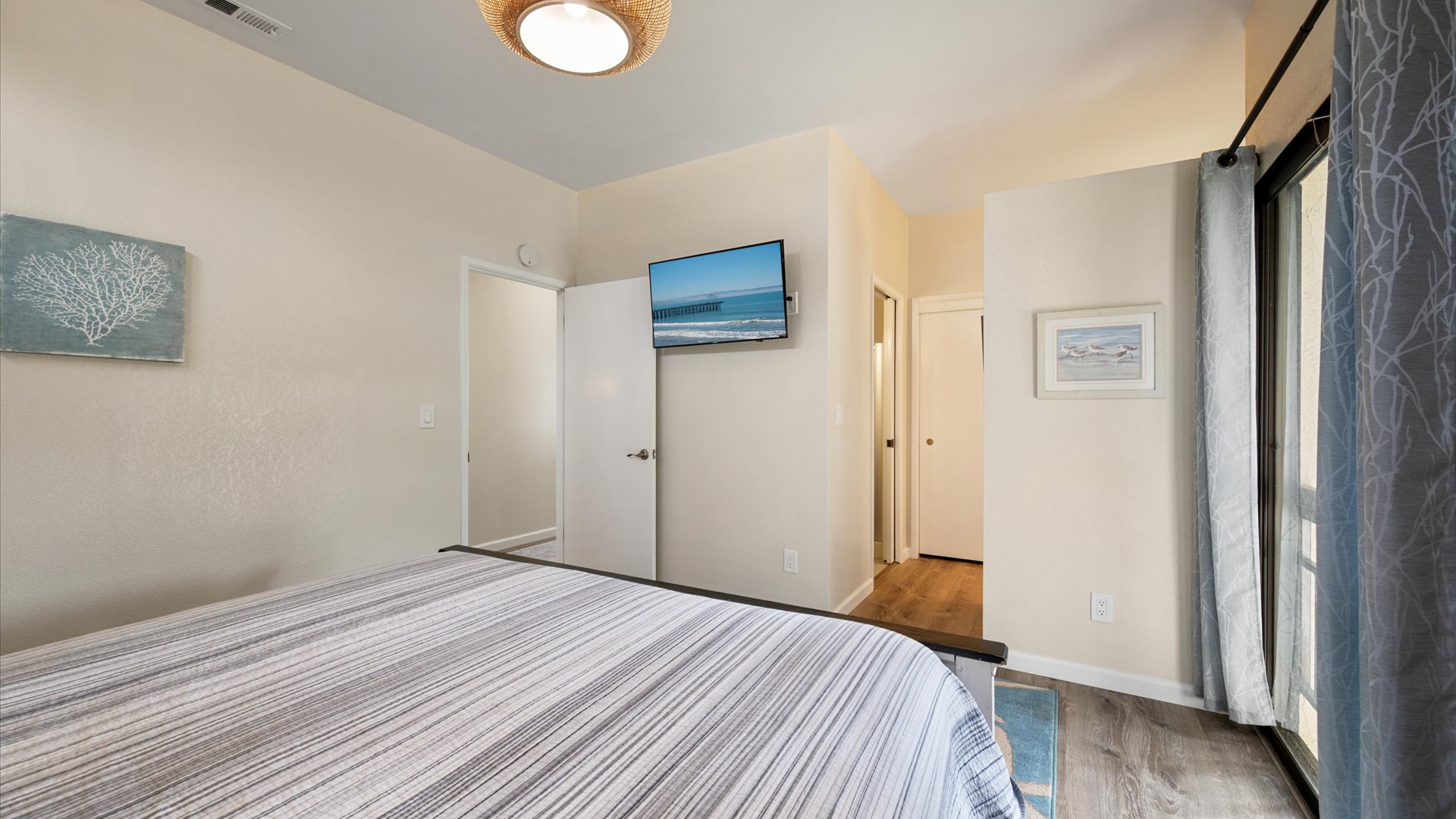 Master bedroom also features a flat screen tv and en suite bath