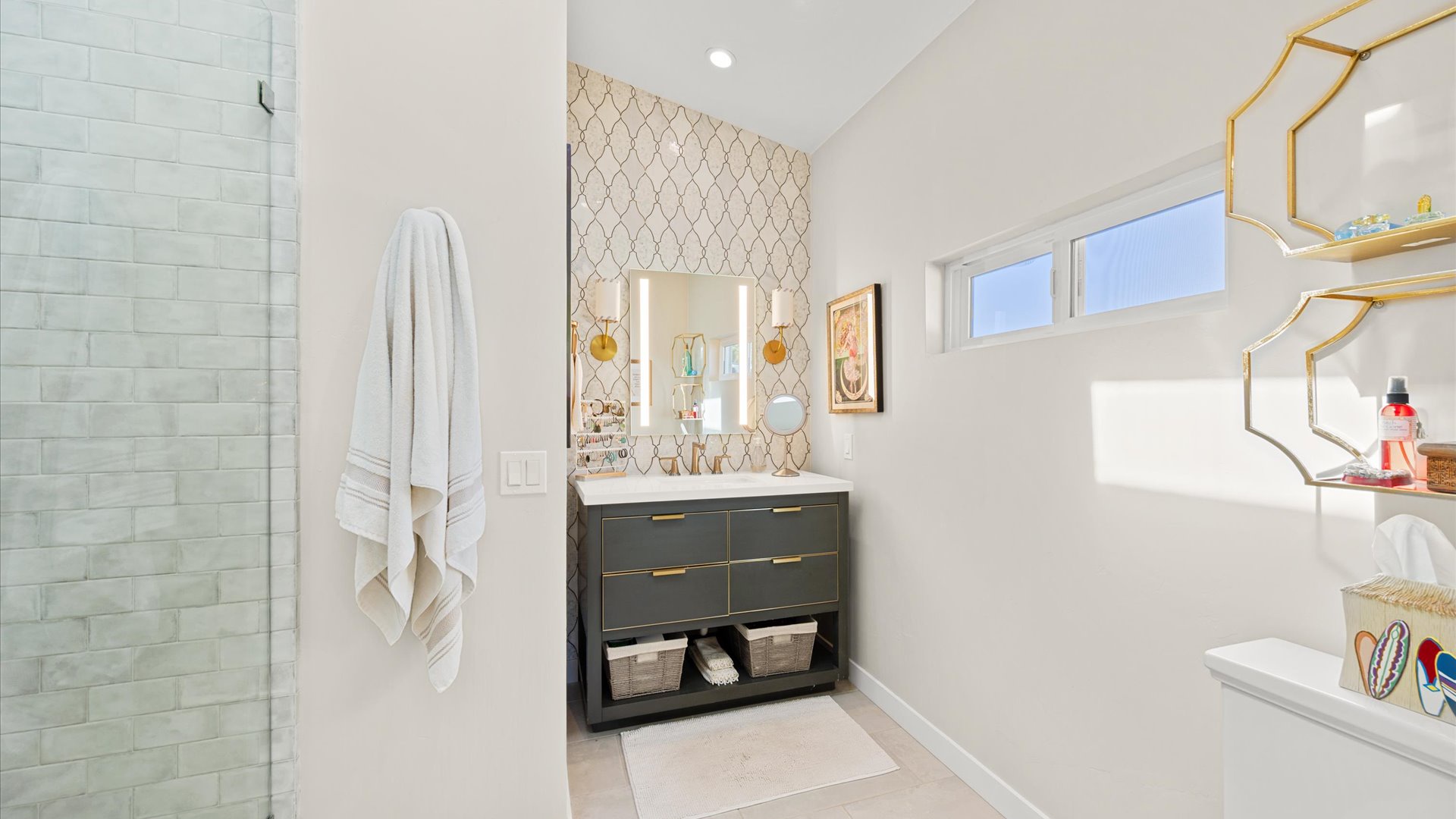 The spacious master bathroom features a vanity and large step in shower