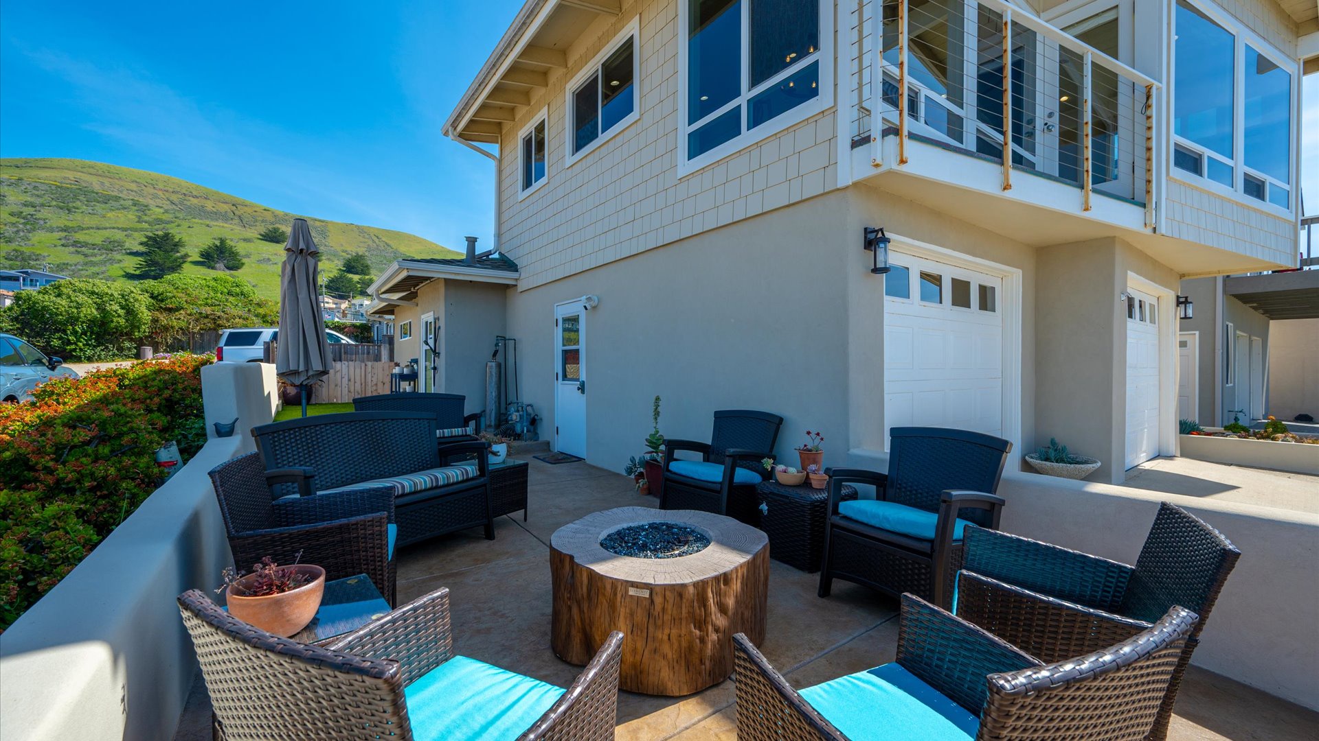 The front patio connects to the side yard and offers a great space for the whole group to enjoy outside