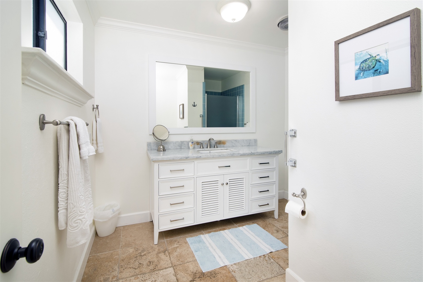 The master bathroom has a step in shower.