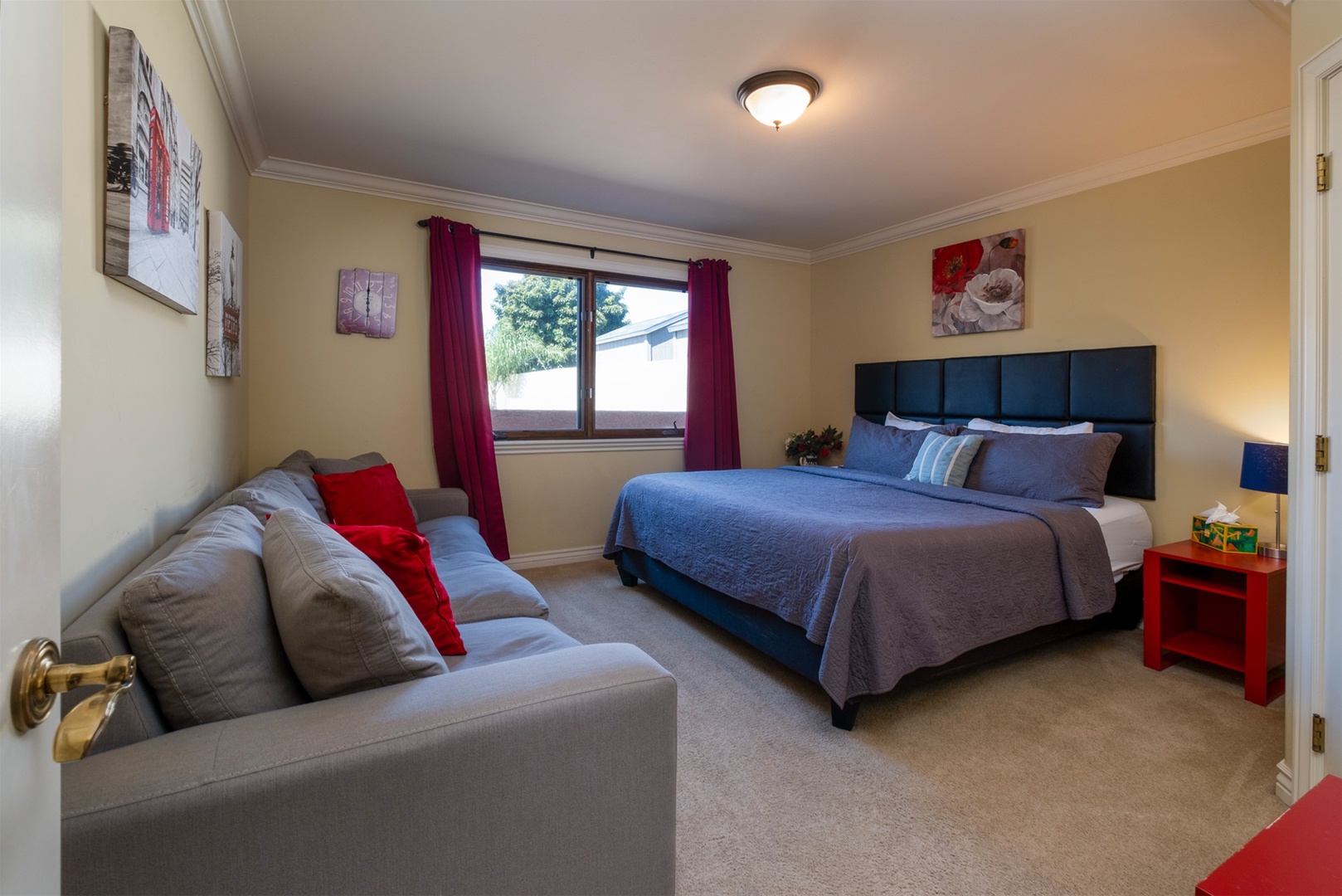 Fourth bedroom has a king bed and sofa.