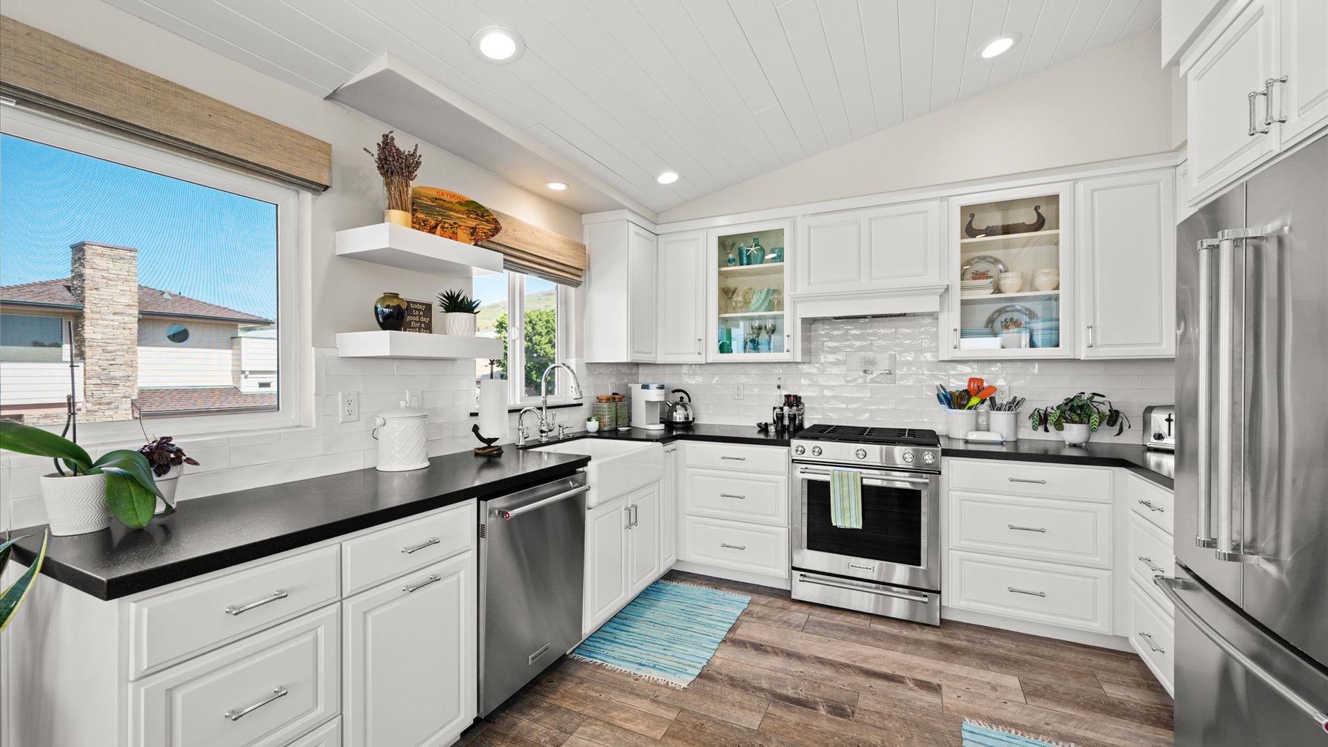 Cook up memorable meals in this bright, modern kitchen with sleek appliances and ample counter space for your culinary adventures.