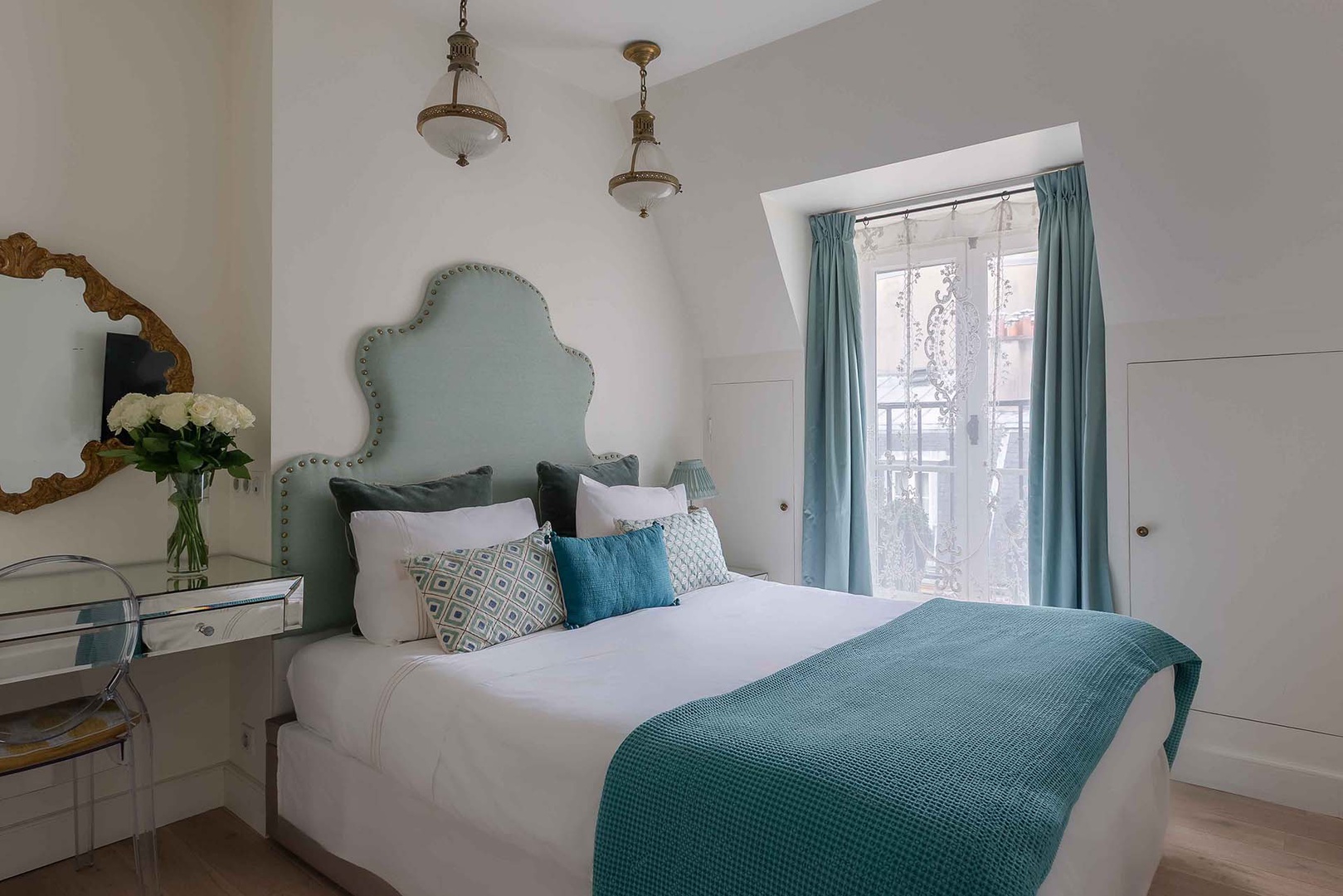 Bedroom has a tranquil design and step out balcony.