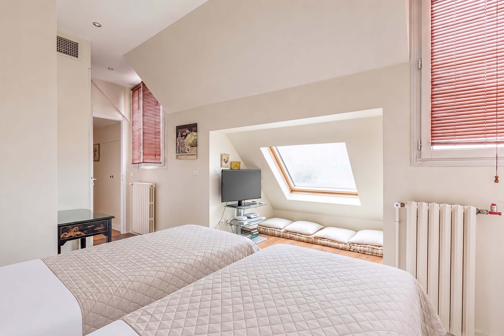 Enjoy beautiful Eiffel Tower views from the seating gallery of bedroom 2.