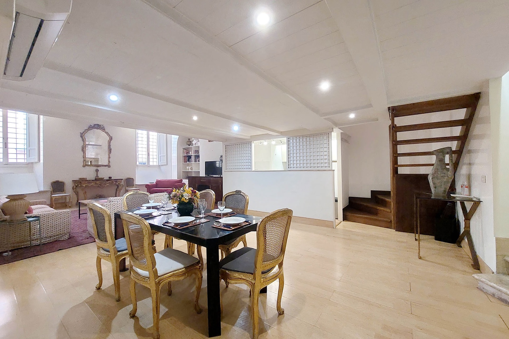 Stairs lead up to the loft with the bedroom and bathroom.