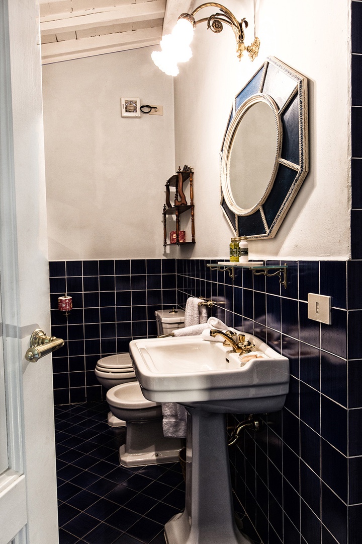 En suite bathroom 1 with sink, toilet, bidet and shower.