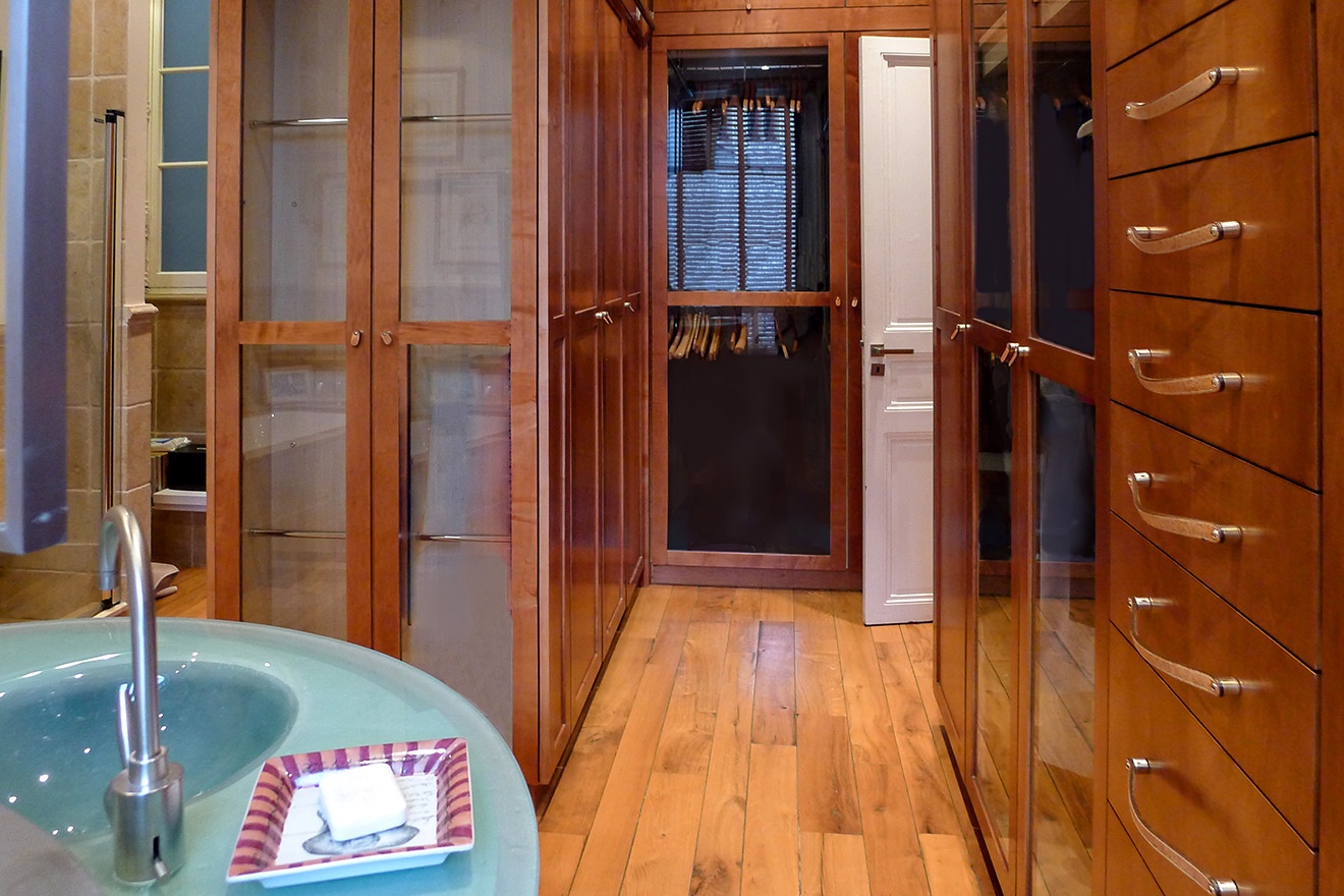 There are also handcrafted teak closets with glass doors.
