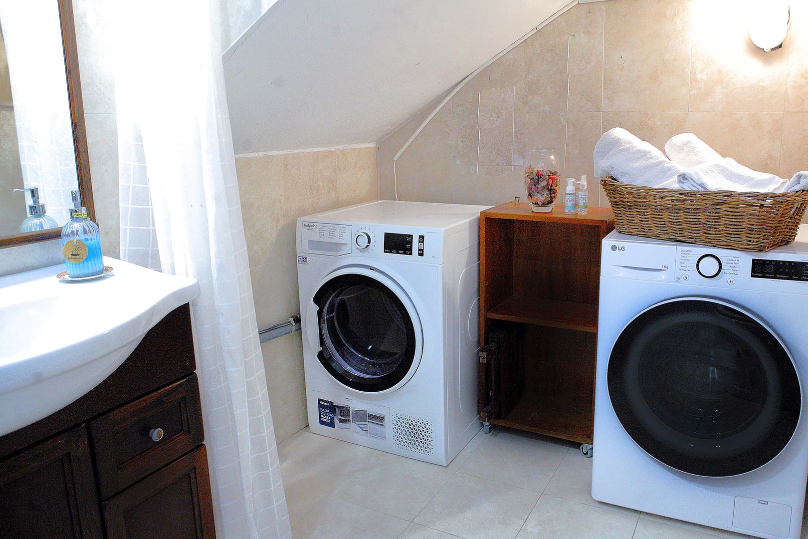 Convenient laundry area in first floor bathroom.