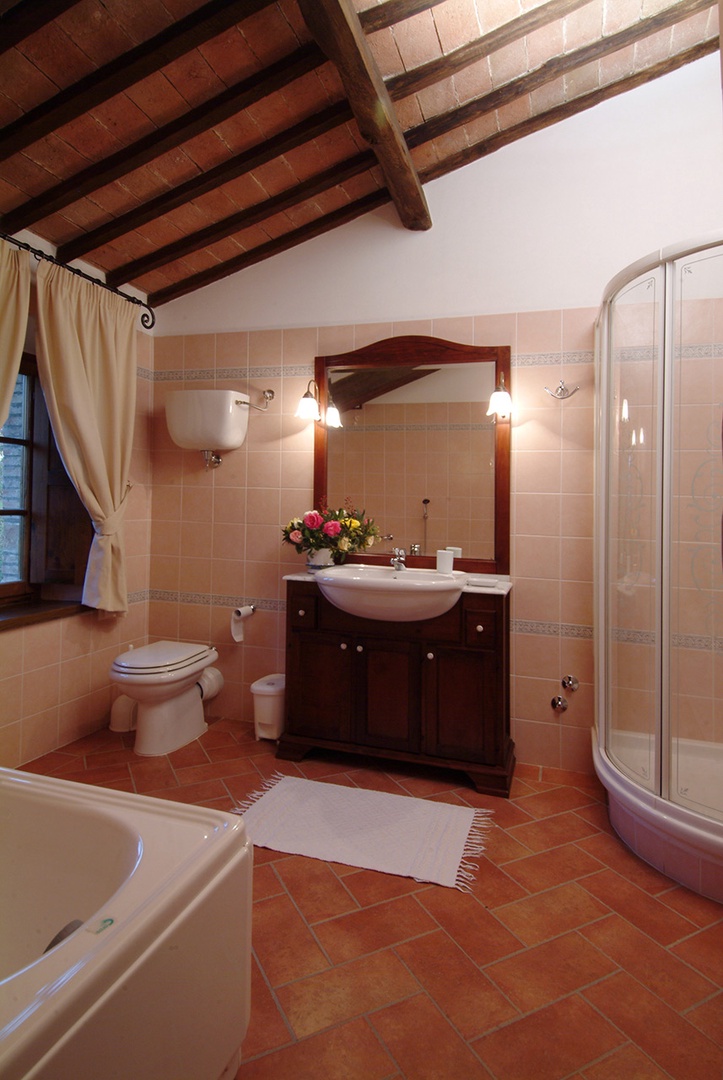 En suite bathroom with bathub and shower