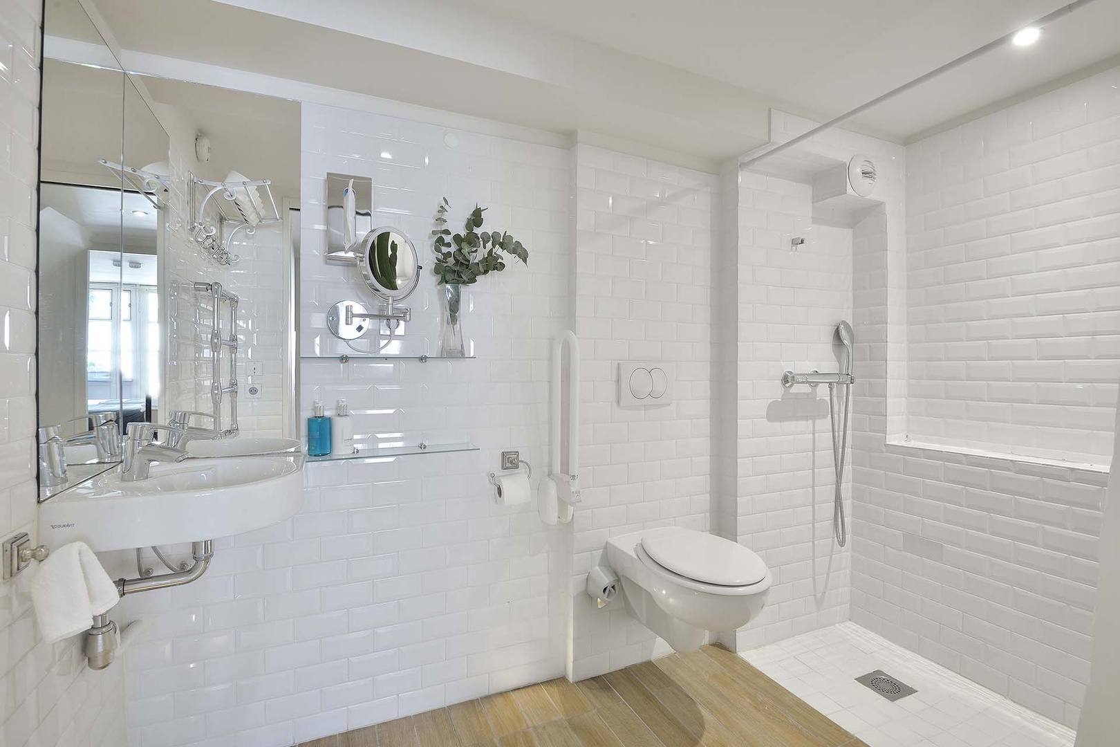 Bathroom 2 is equipped with an open shower.