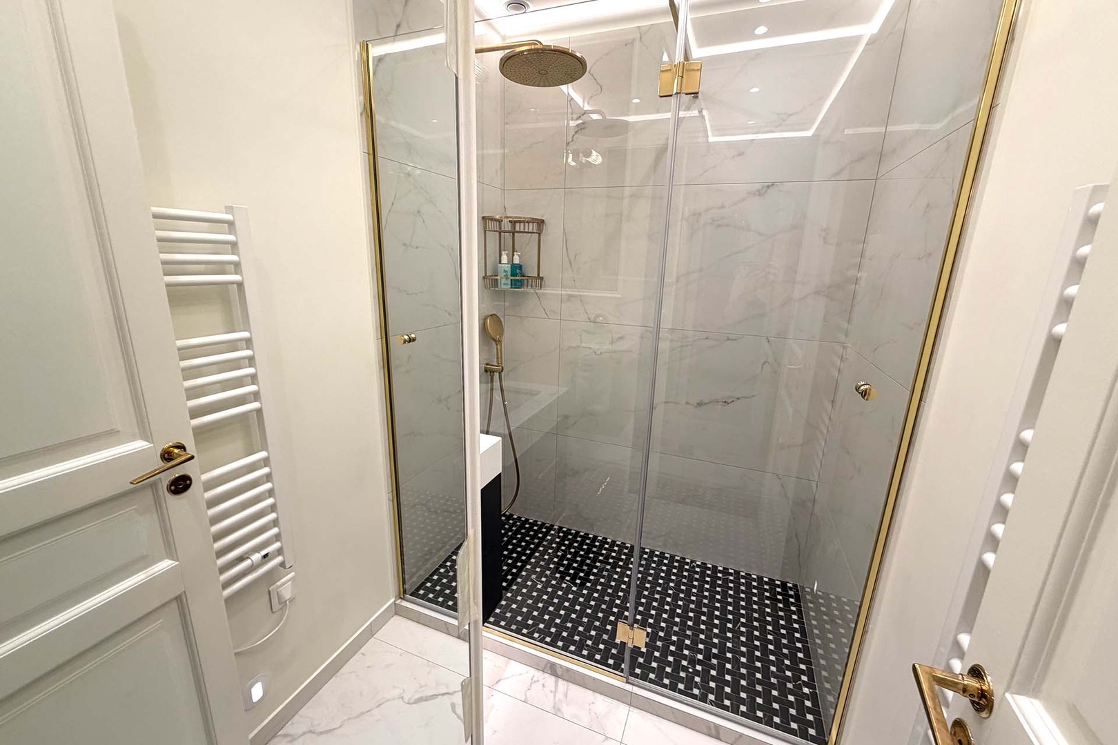 Bathroom 2 with shower and sink. Second toilet in a separate powder room.