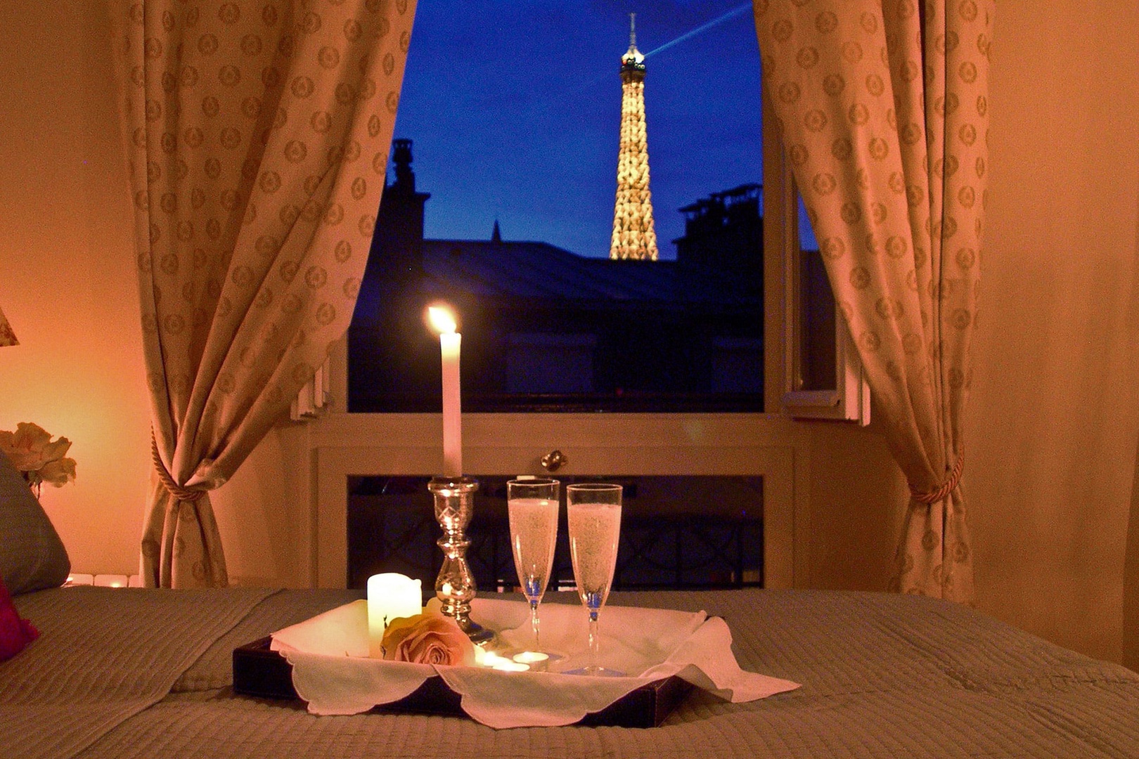 Enjoy stunning evening view of the Eiffel Tower from bedroom 1!