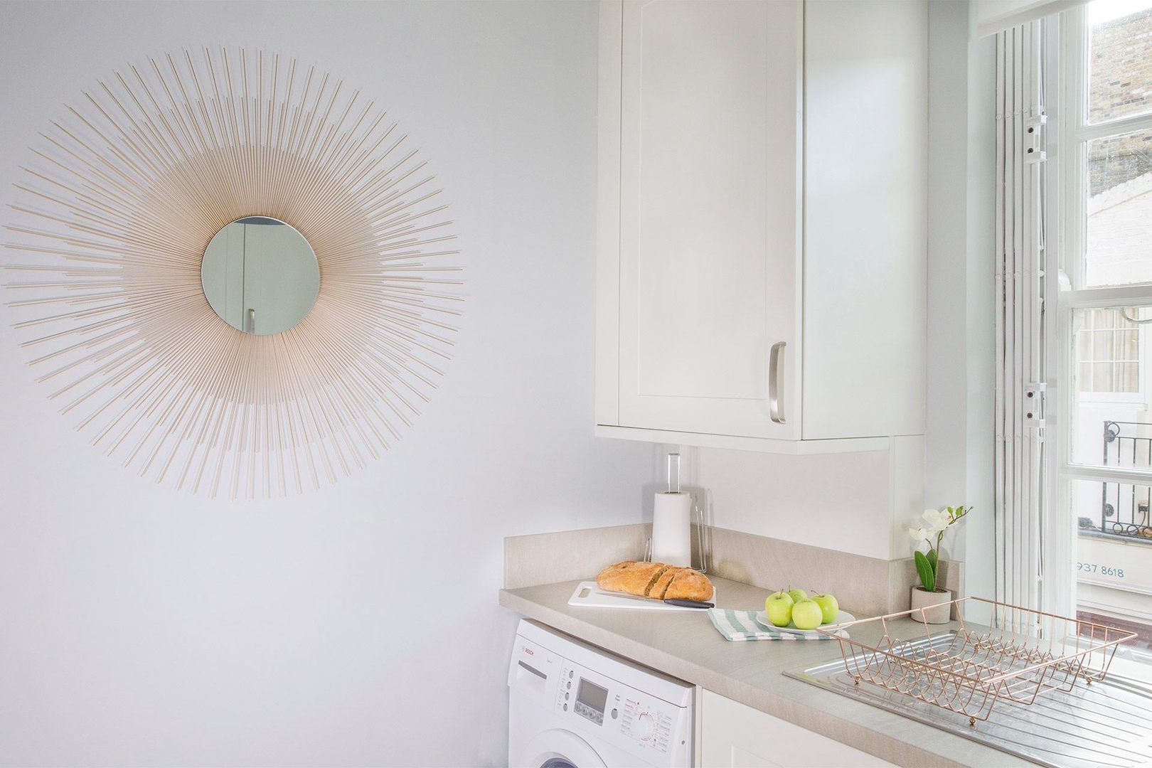 Combination washing machine and dryer in the kitchen