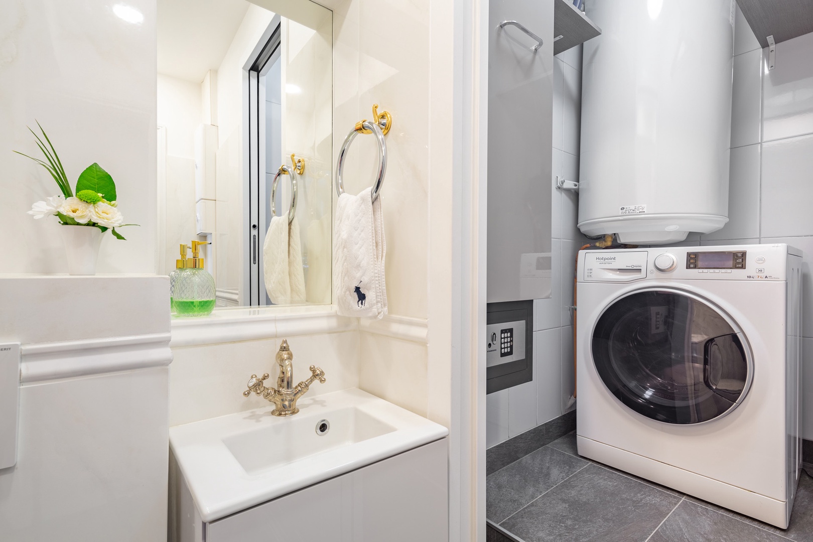 Laundry room is adjacent to the half-bath.