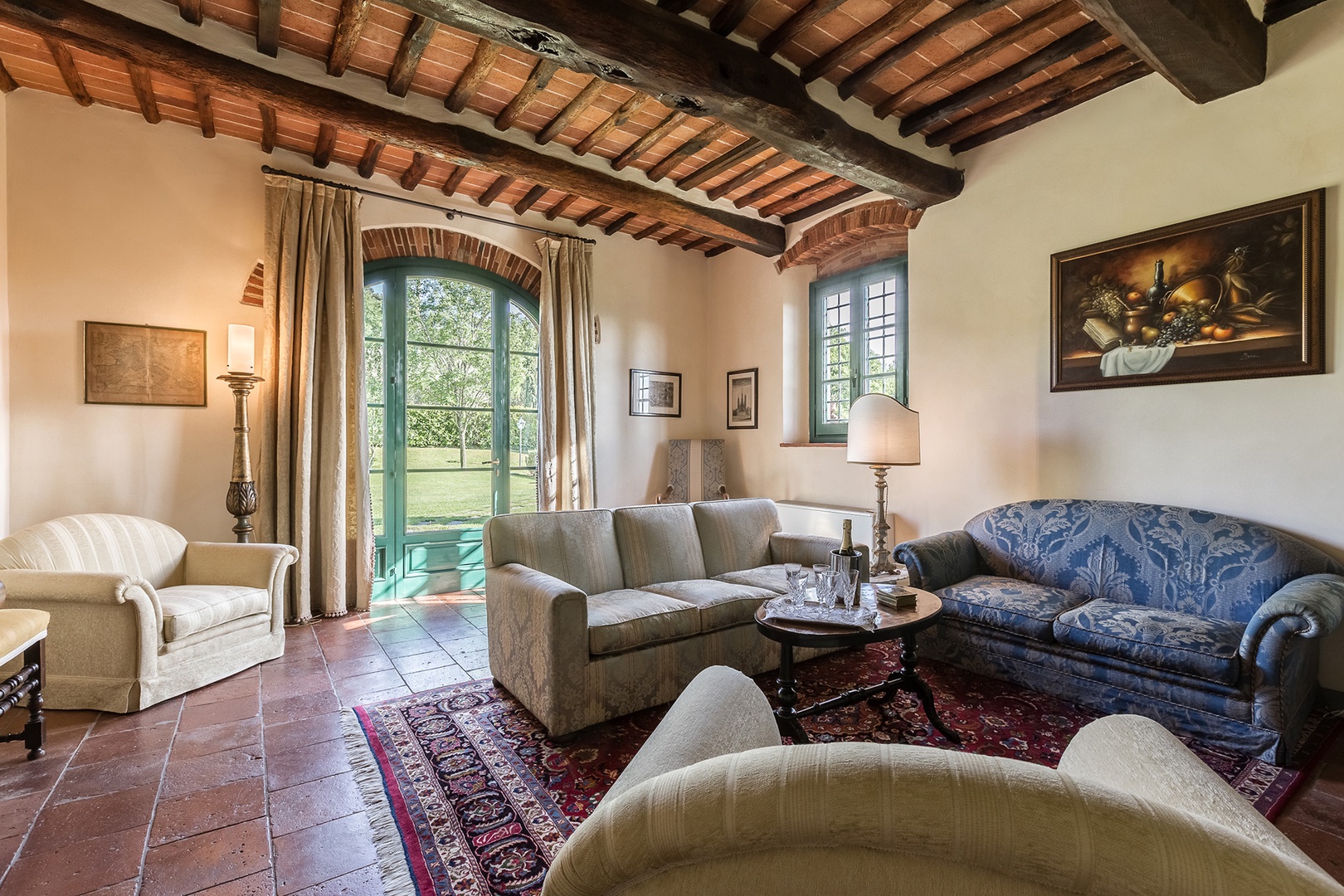 One of three living rooms, this one has a nice garden view and access through french doors.