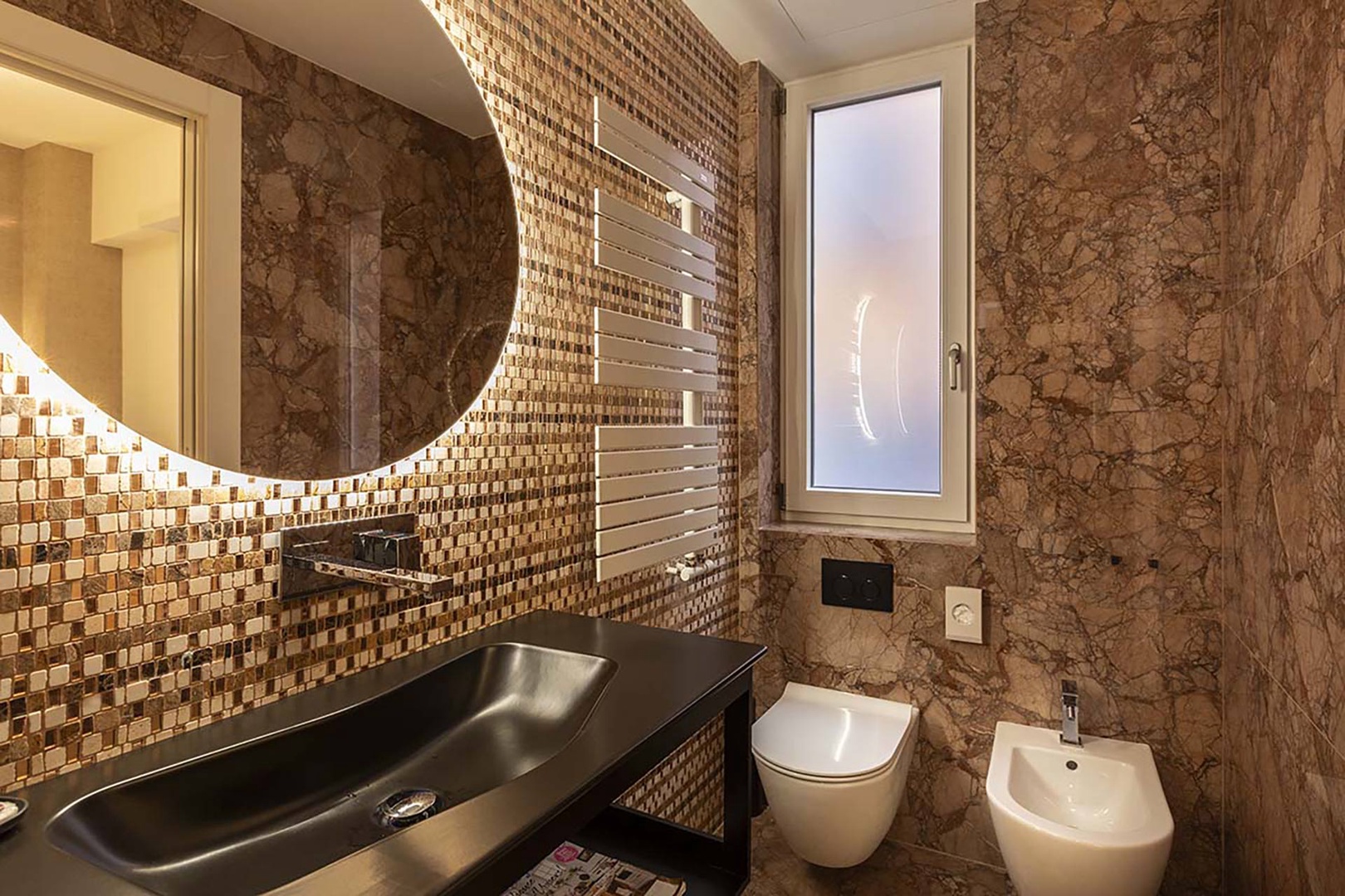 Bathroom 1 has beautiful gold inlay tiles and a steam room.