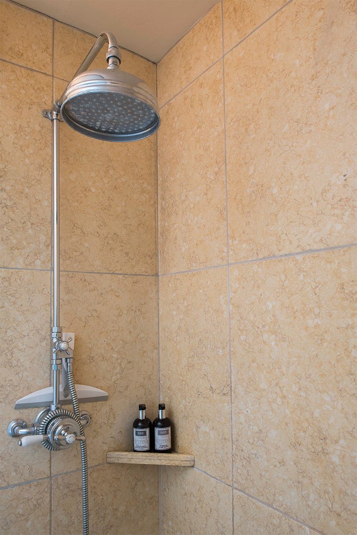 Rainfall showerhead in the first bathroom