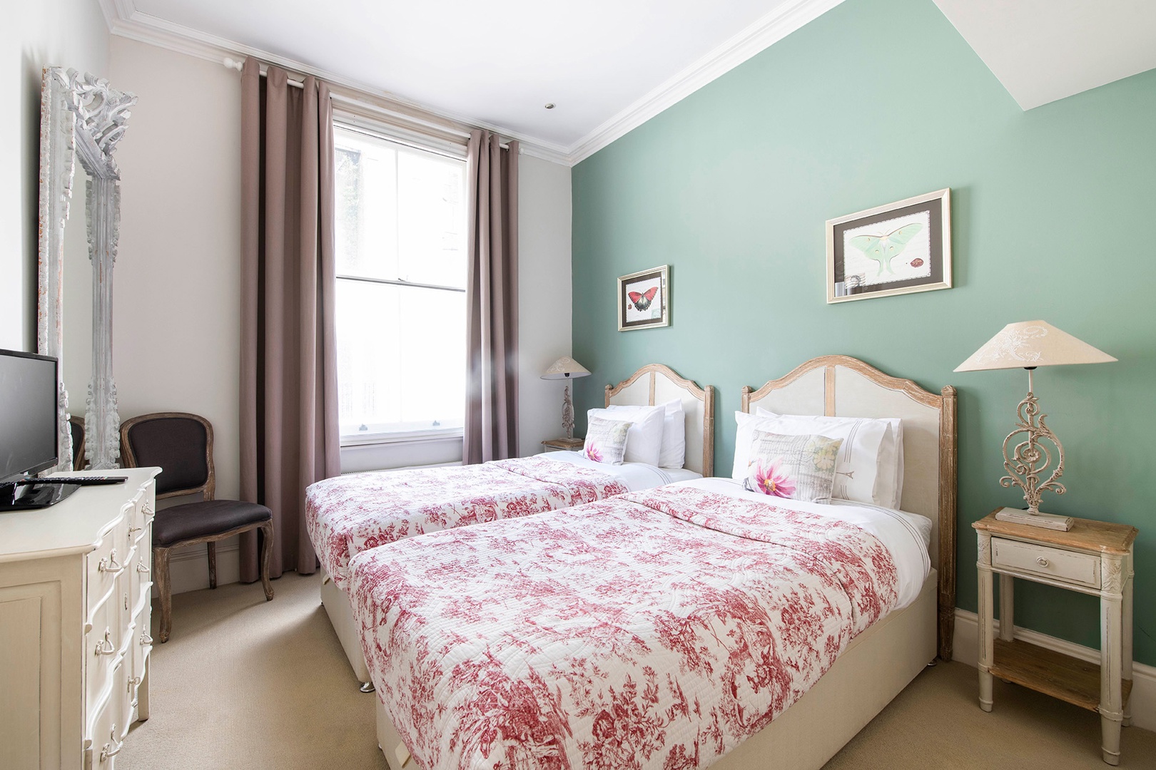 Bedroom 2 with two cozy beds that can be combined to form one bed.