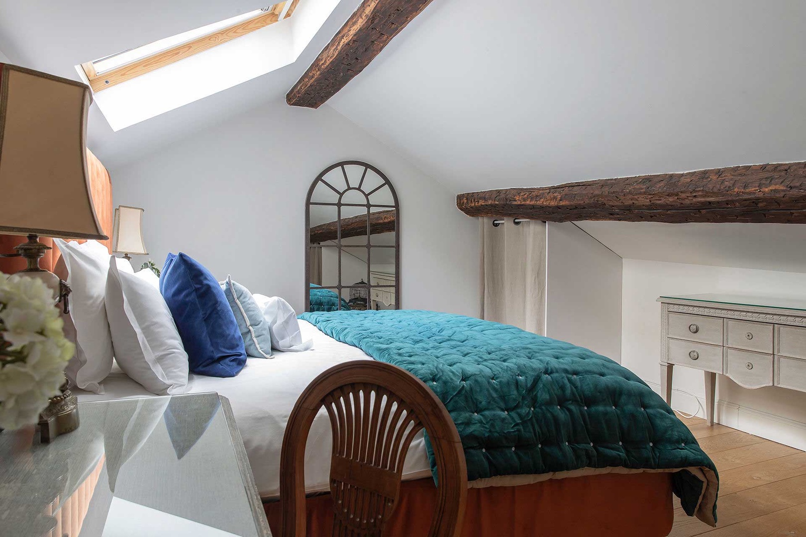 Exposed wood beams at a historic touch.