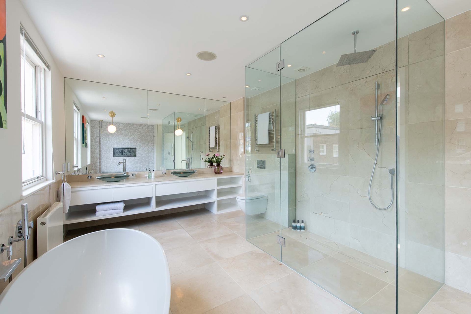 Spacious en suite bathroom with large shower.