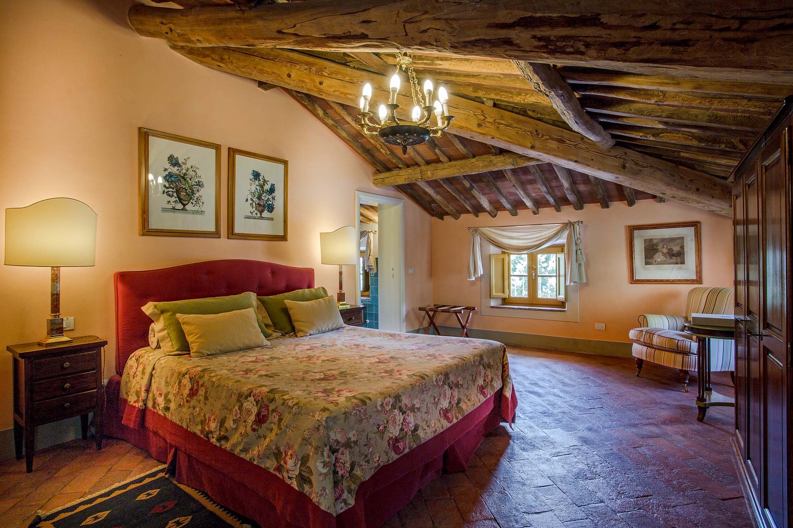 Spacious bedroom with wood beamed ceilings