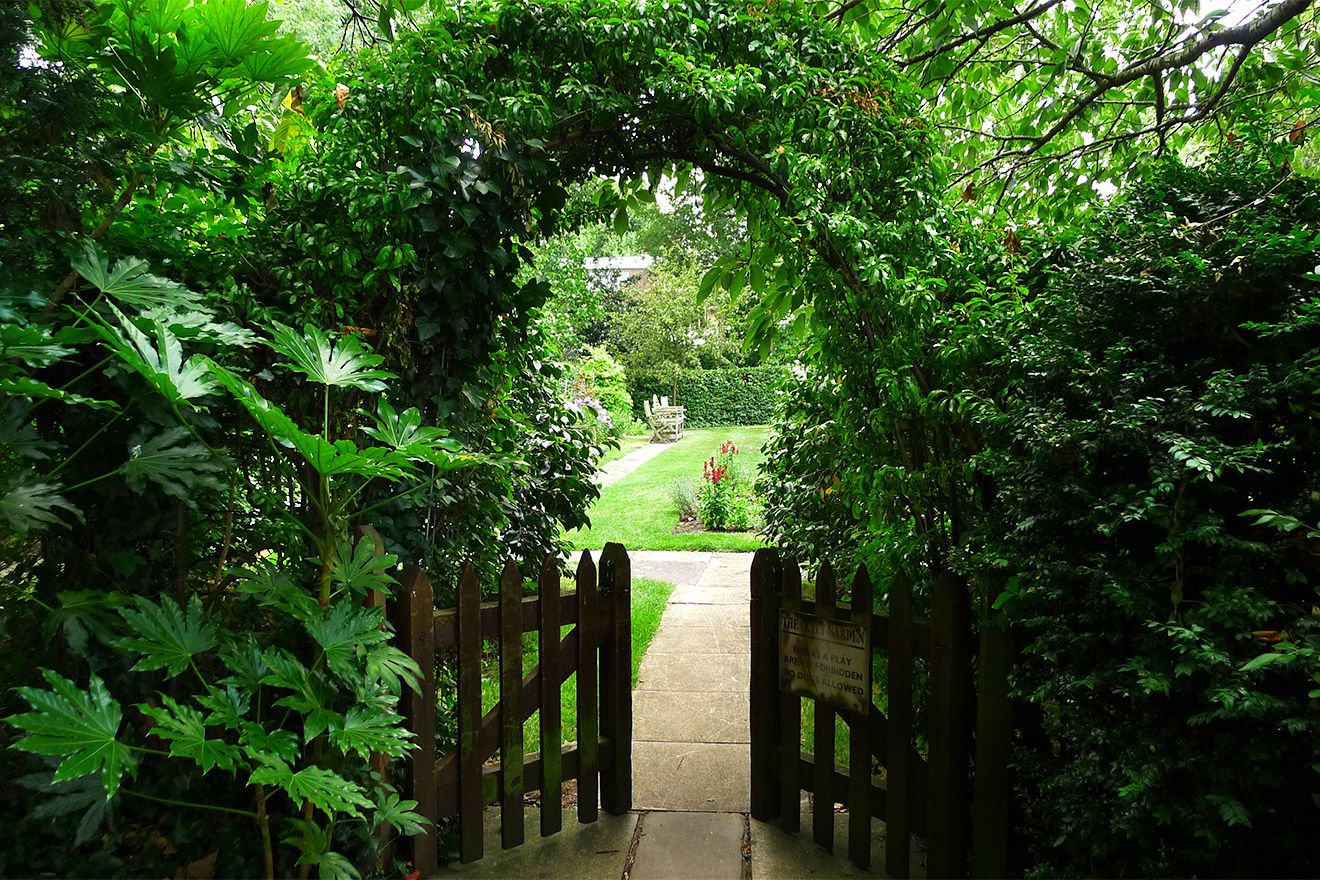 A secluded entrance to the shared garden.