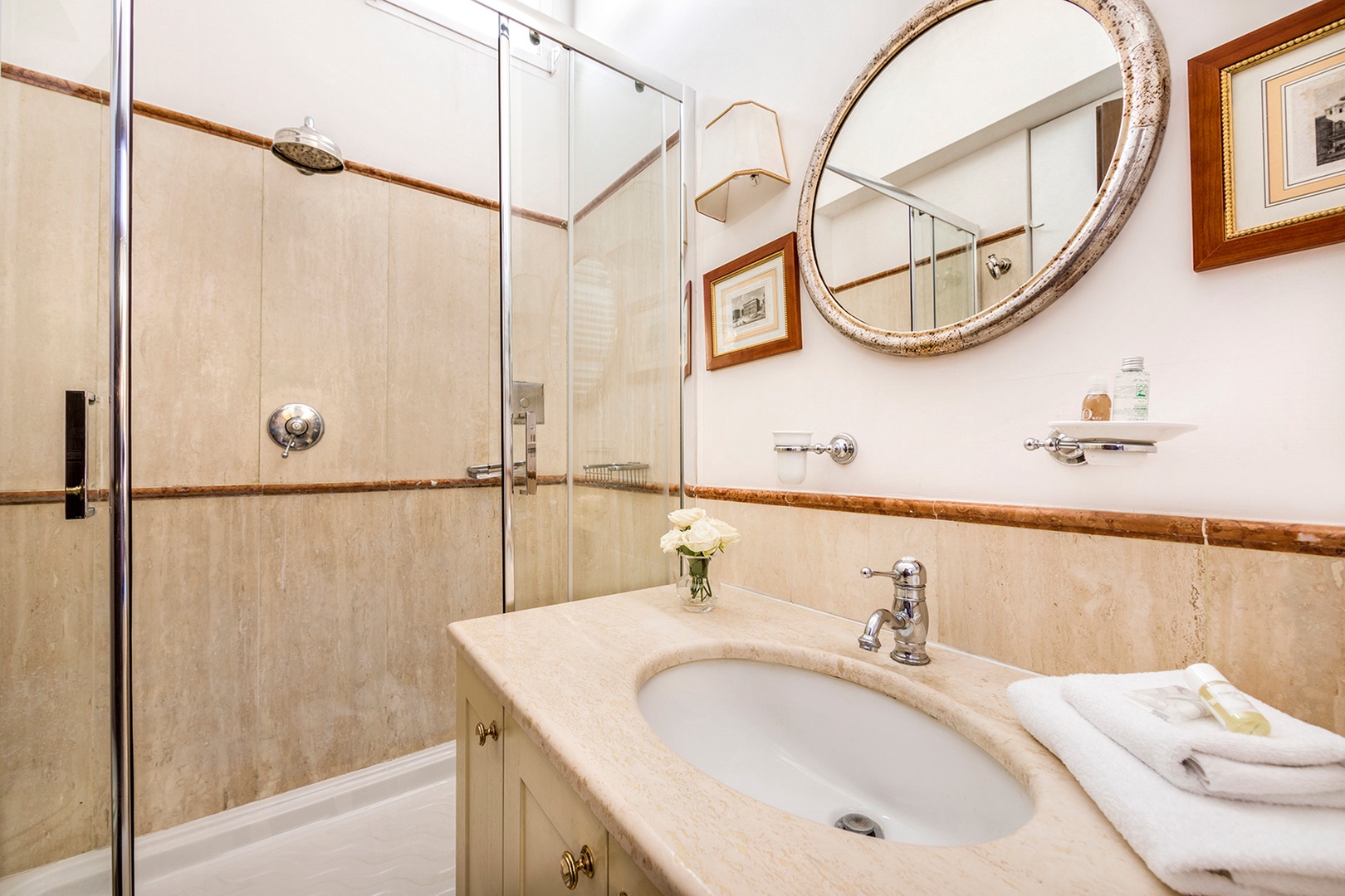 En suite bathroom 2 with shower, sink and toilet.