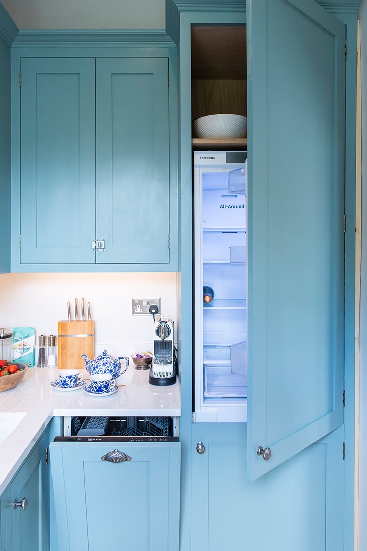 Easily accessable dishwasher and refrigerator hidden within the cabinets