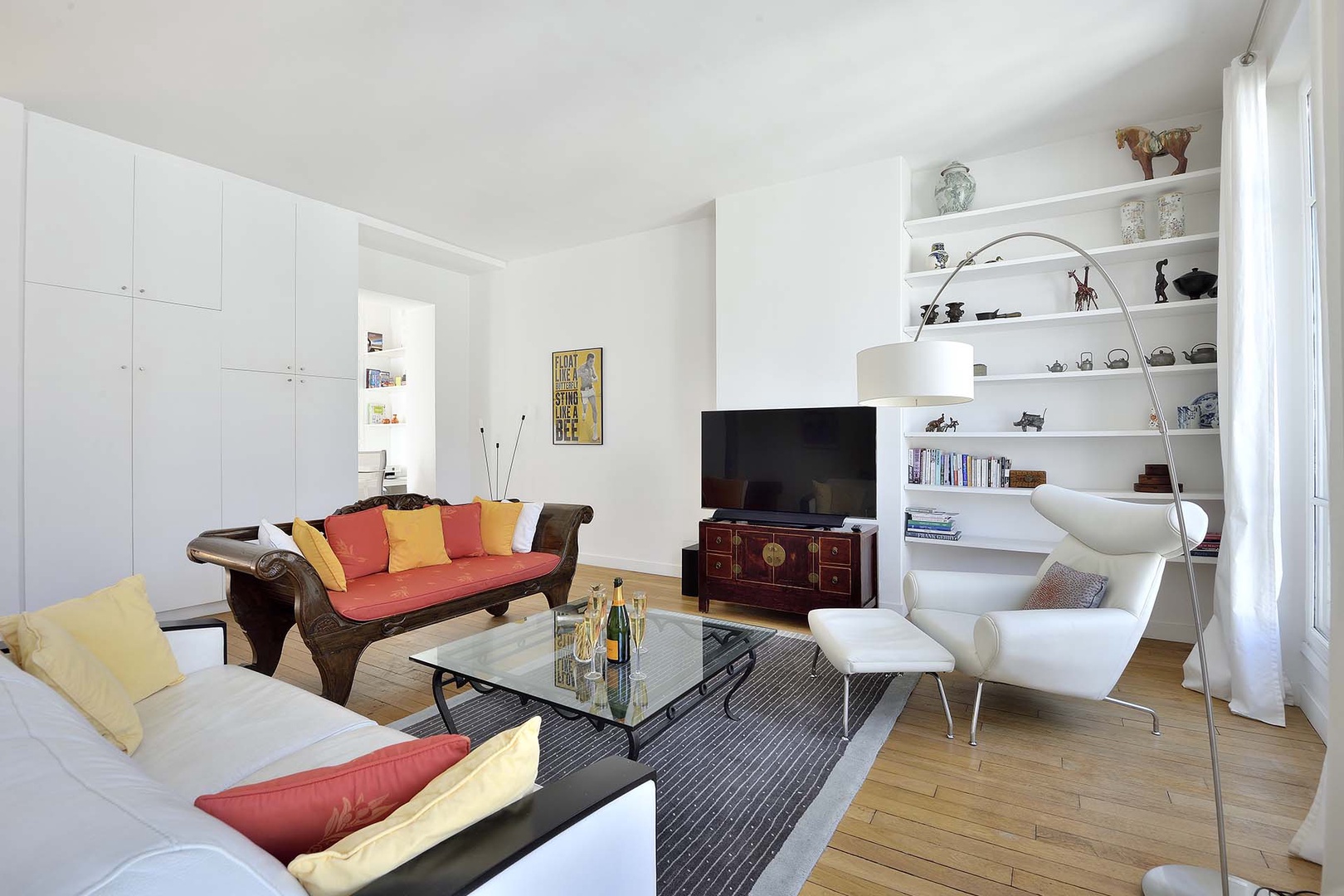 Double sofas and stylish accent chair in living room.