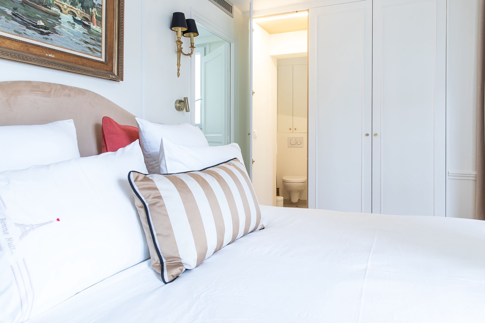 The toiliet is located in separate powder room in bedroom 1.