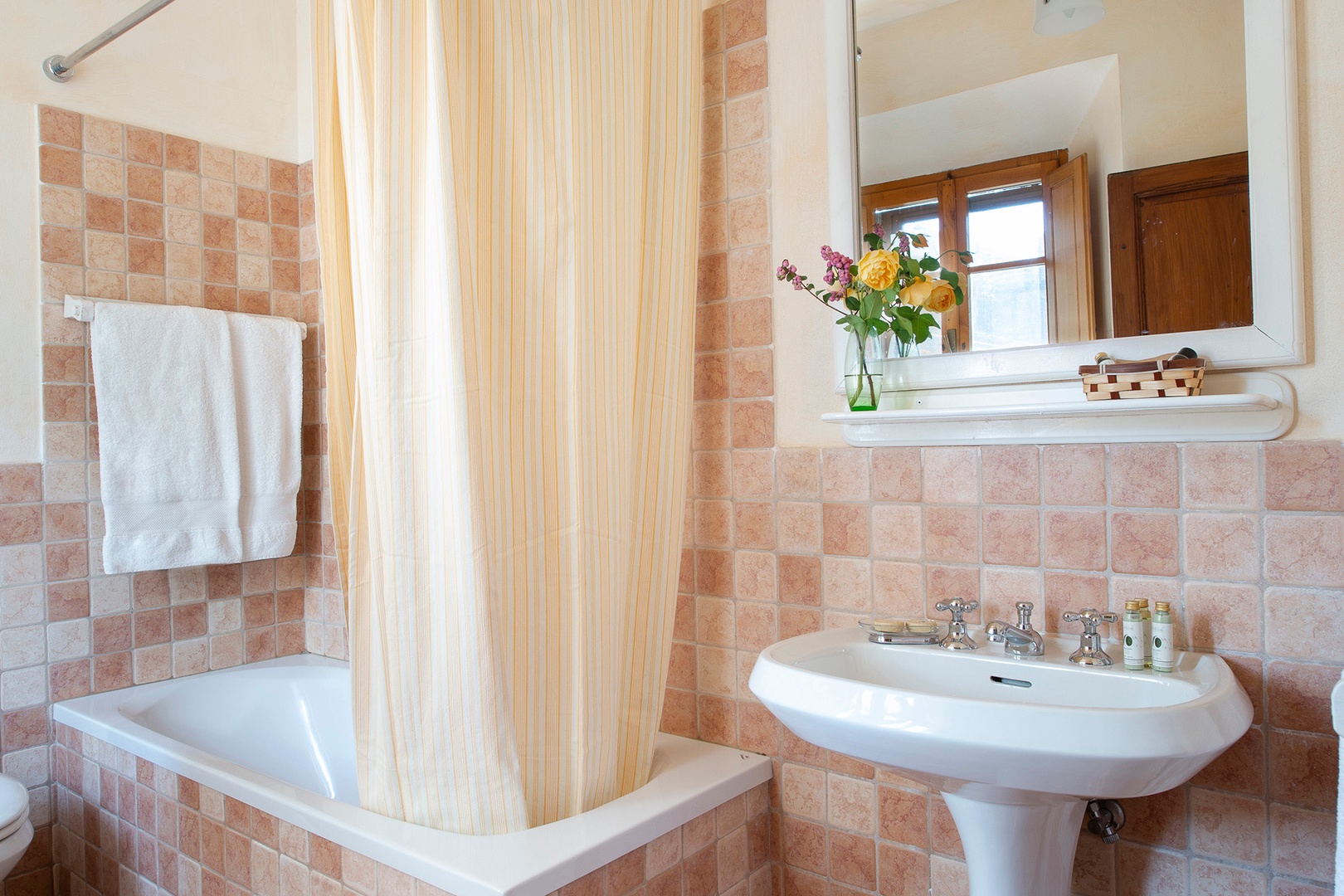 Bathroom 1 with bathtub adjoins Bedroom 1.