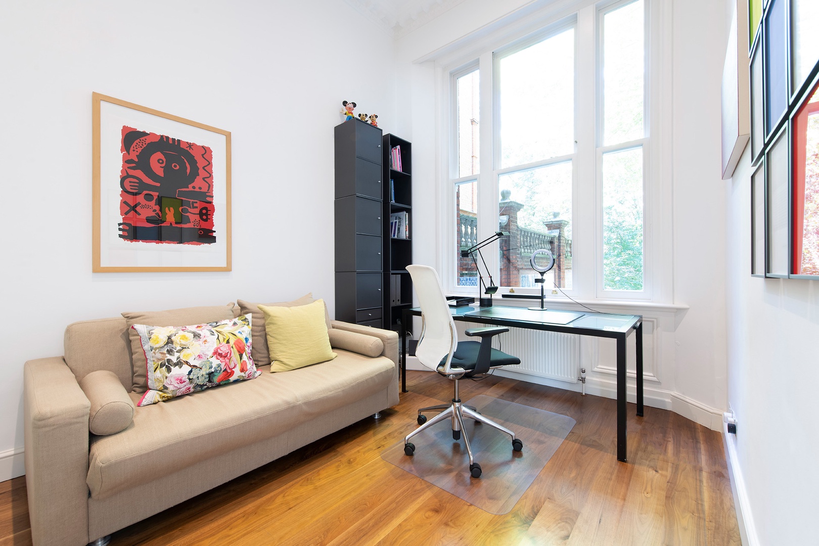 A study with sofa bed is located between the living room and kitchen.