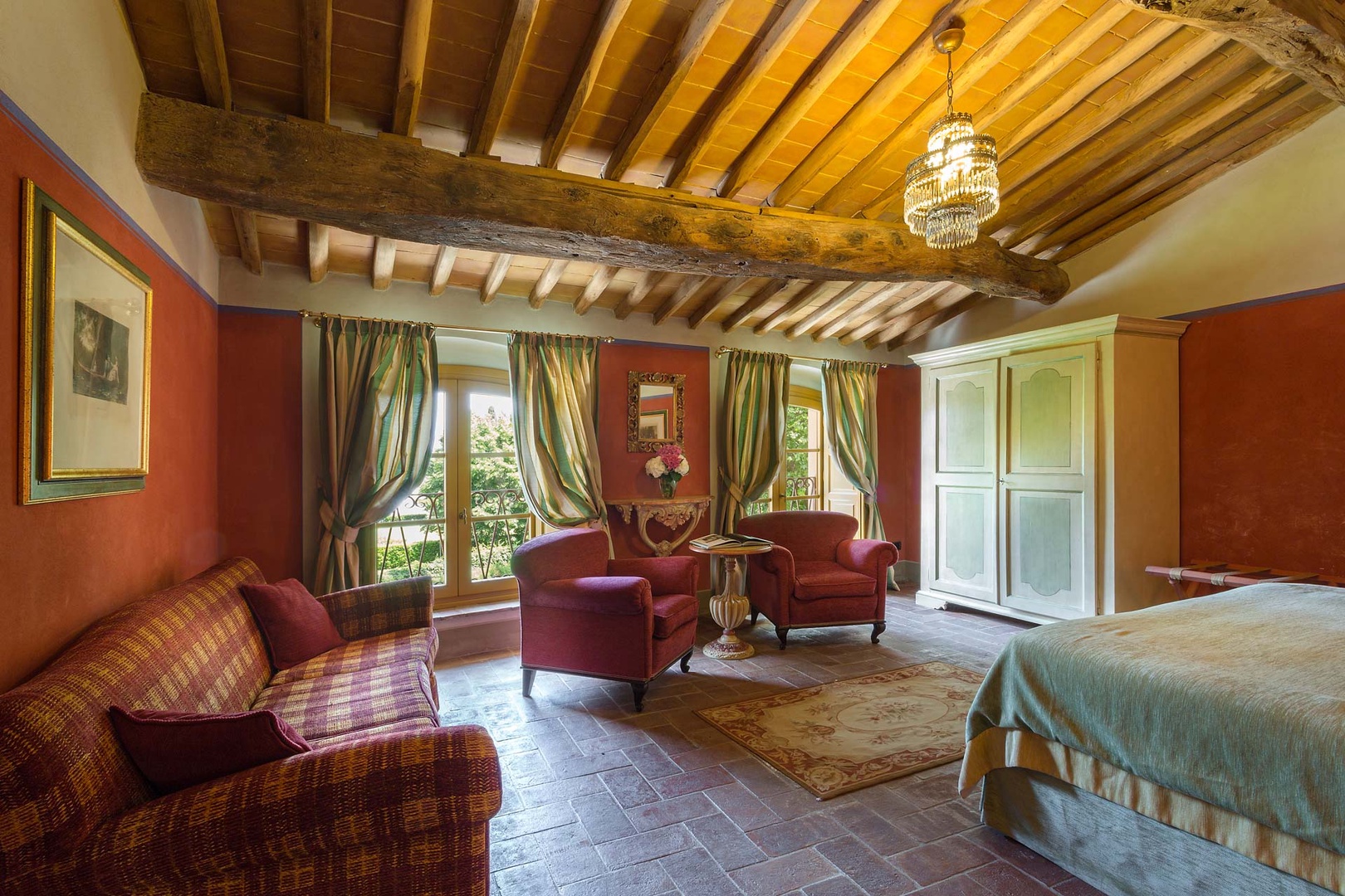 Terracotta floors and wooden beamed ceilings add to the villa's charm