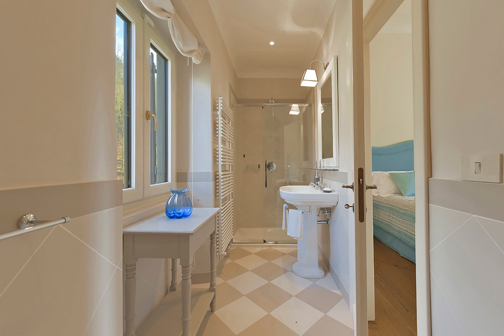 Bathroom 5 features heated towel racks and shower.