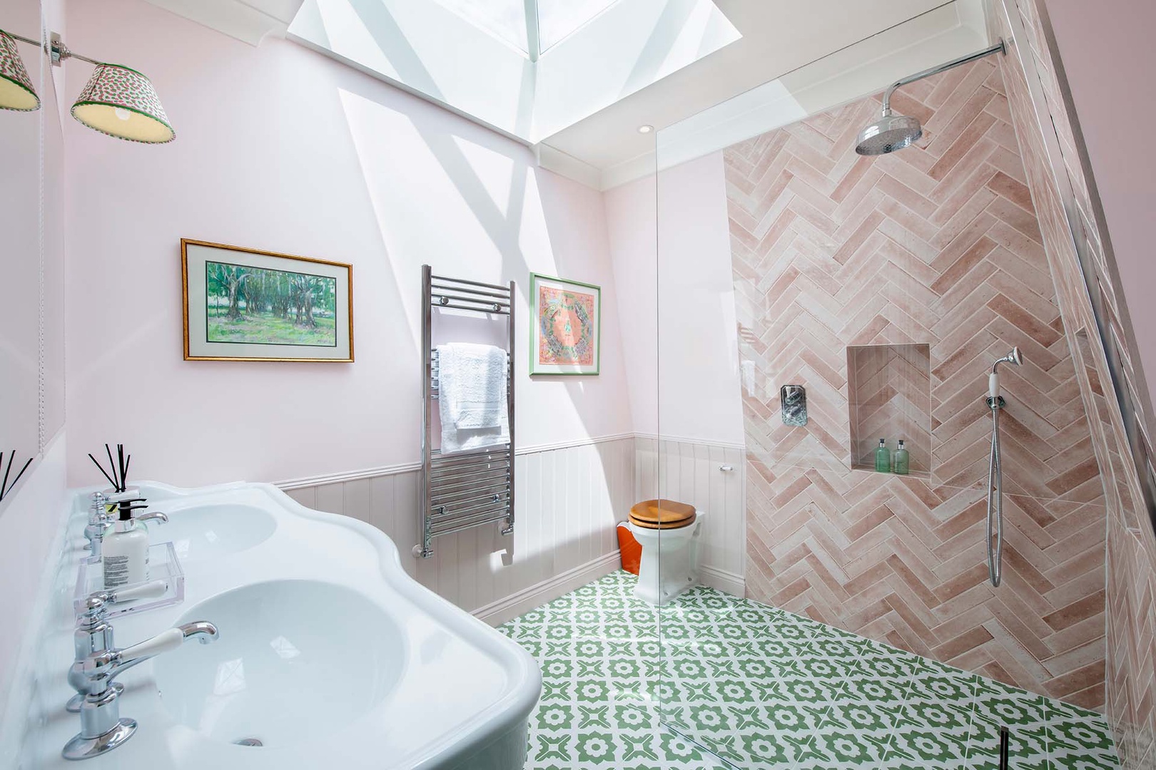 Stunning bathroom 2 has a skylight and large shower.