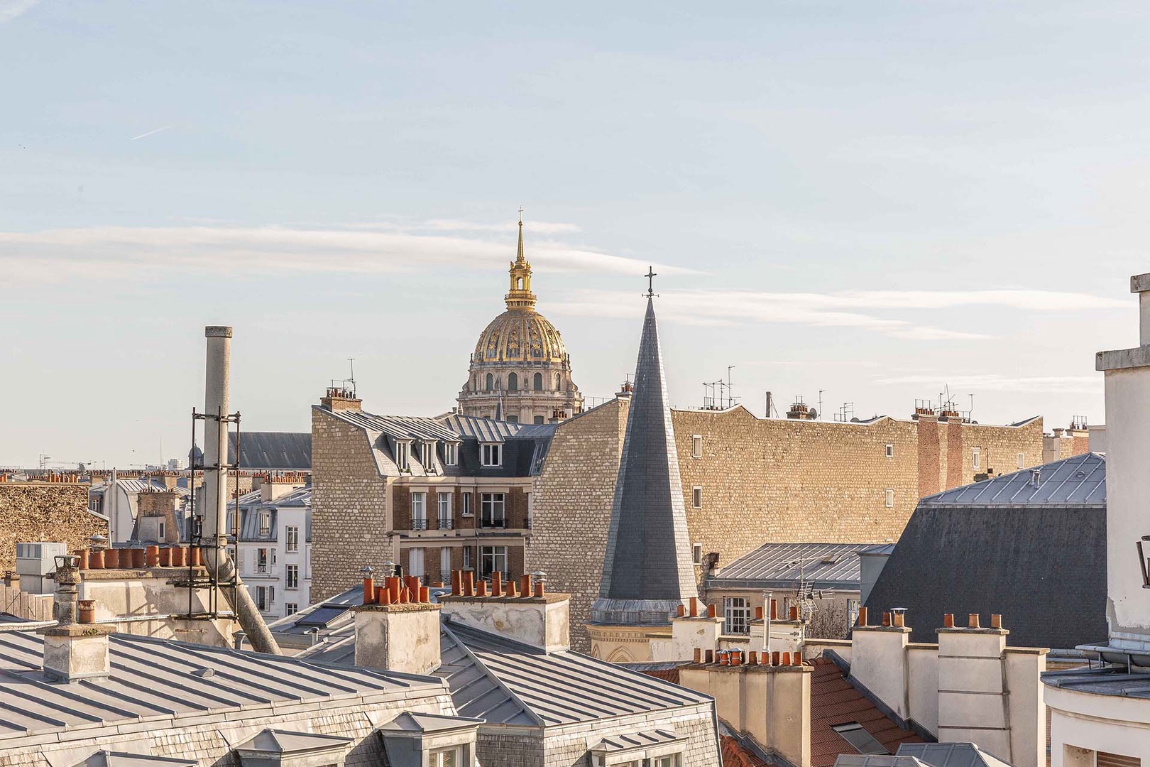 Watch the sun glimmer on the golden dome of Les Invalides.