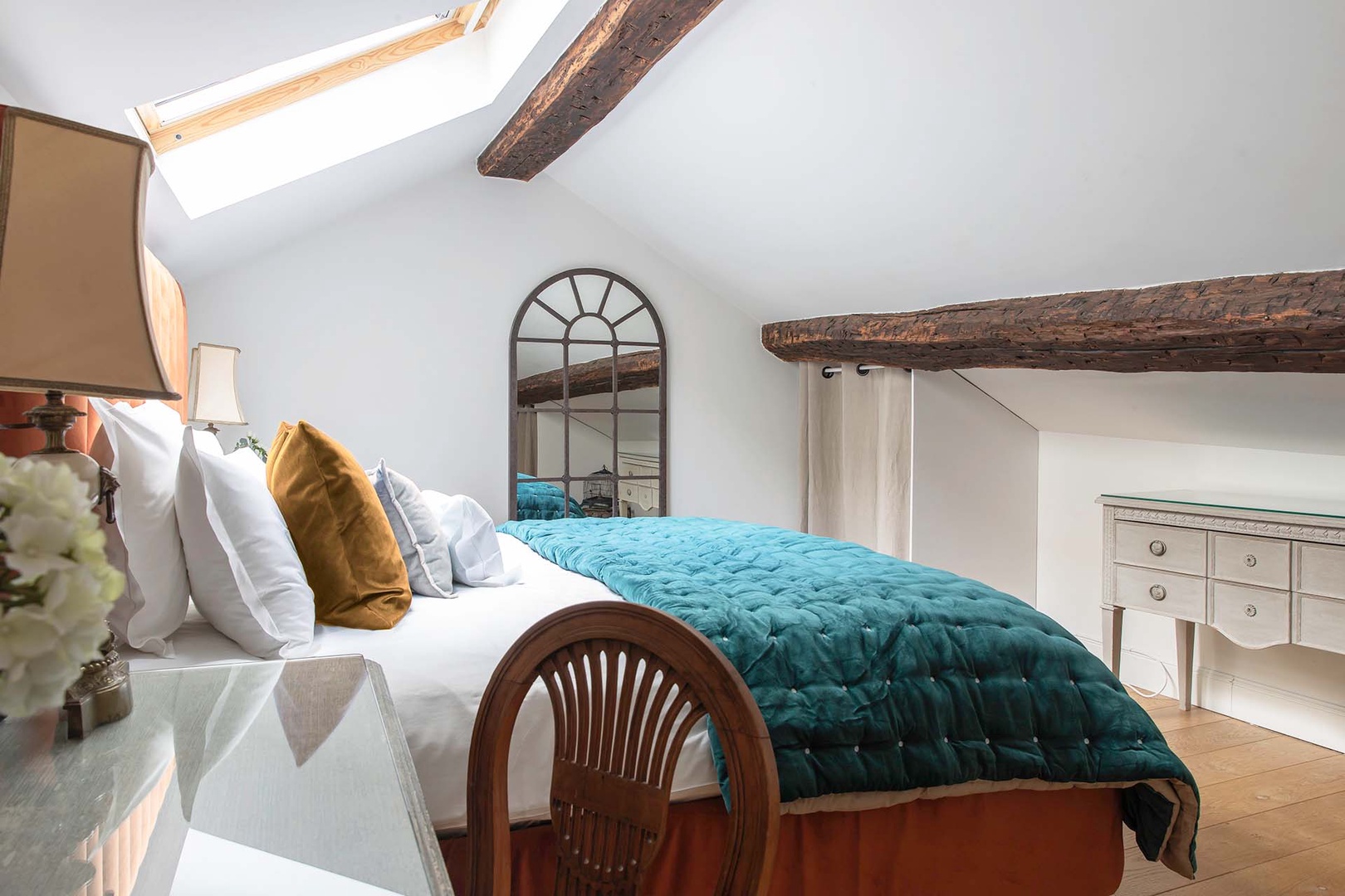 Exposed wood beams at a historic touch.