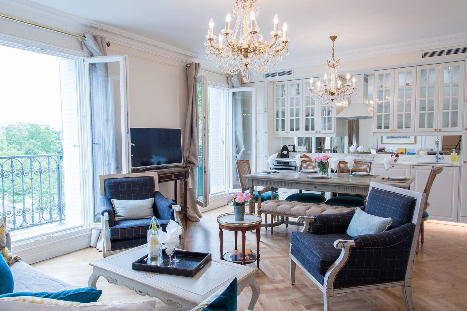 Sunlight streams through the French doors into the living room.