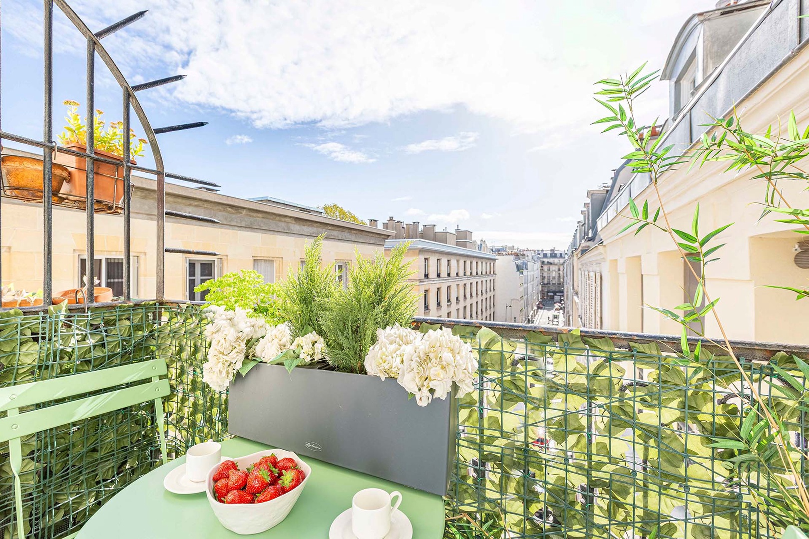 Enjoy your morning coffee on this charming balcony.