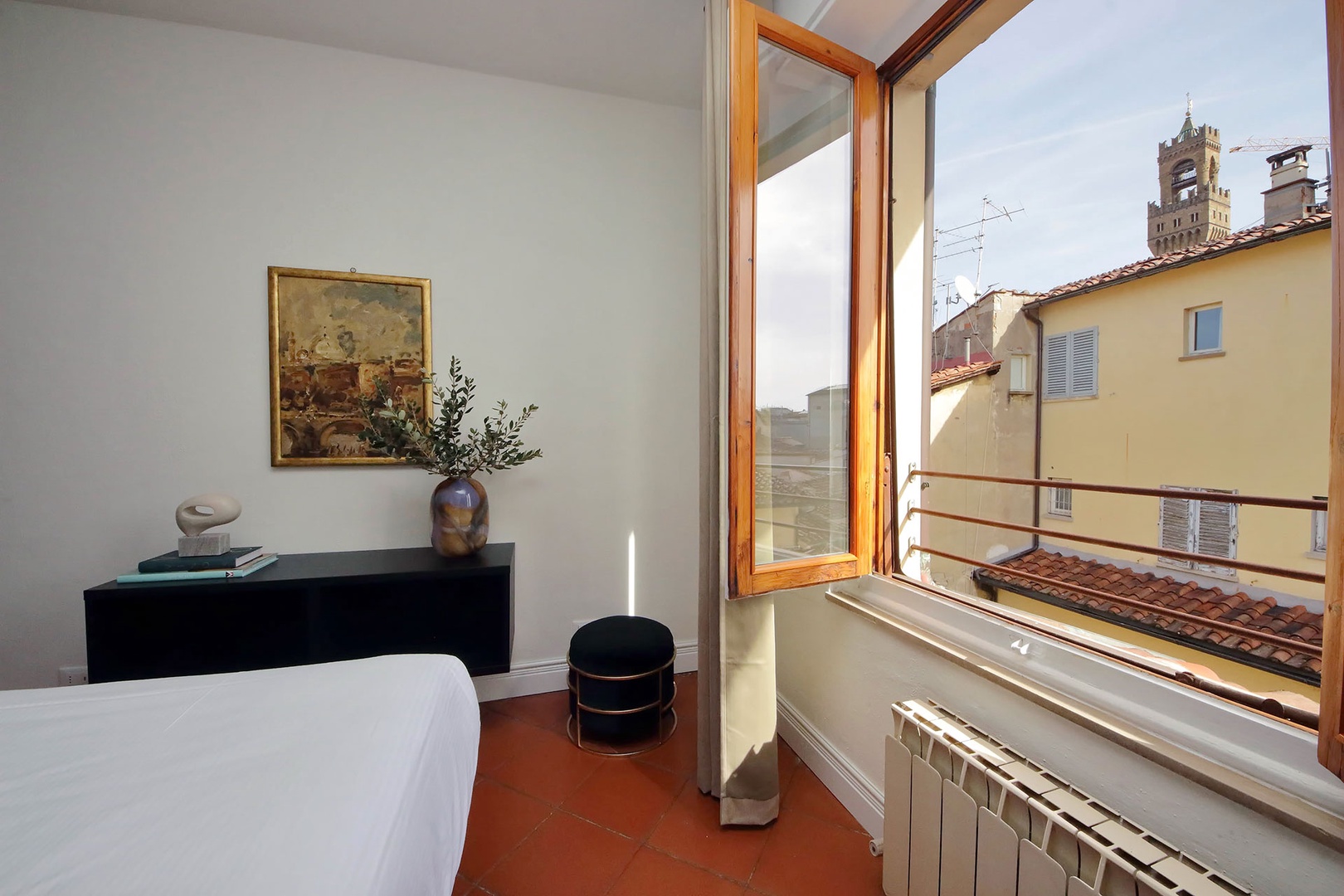 Wake up to the view of Palazzo della Signora bell tower from the bedroom.