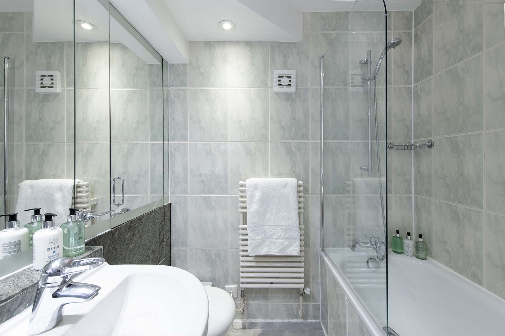 Full bathroom located near bedrooms on second floor.