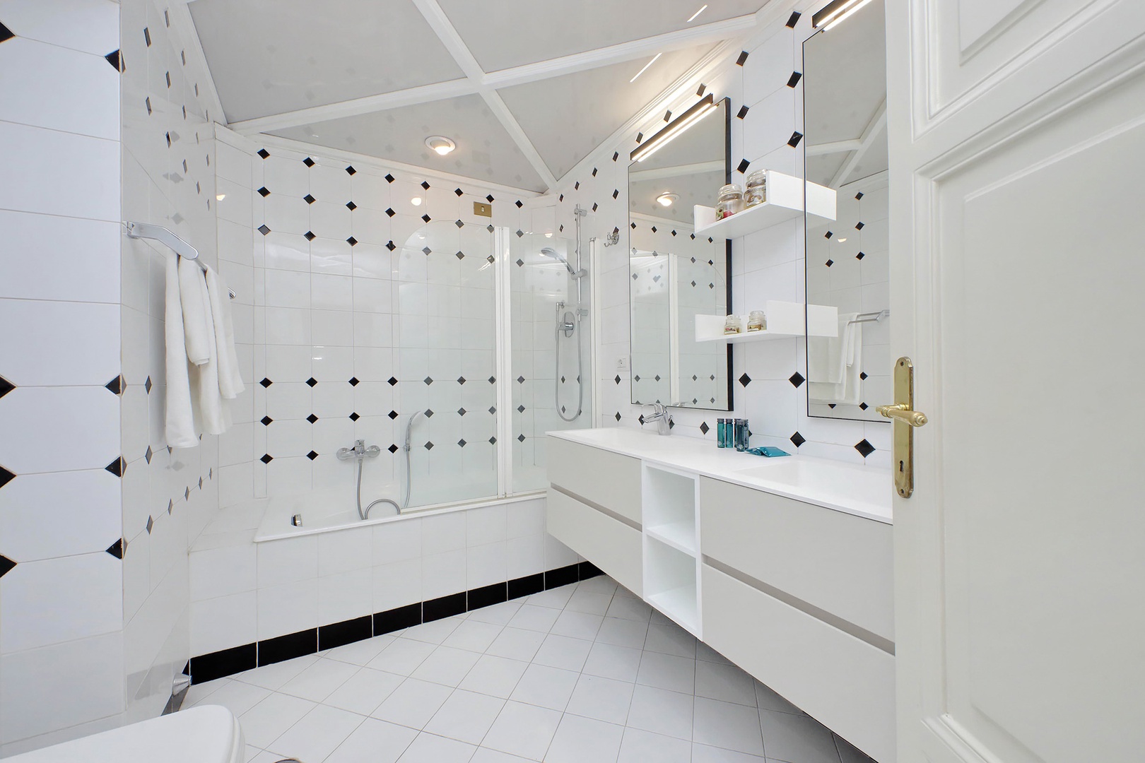 Bathroom 2 with combination shower/tub and double sink