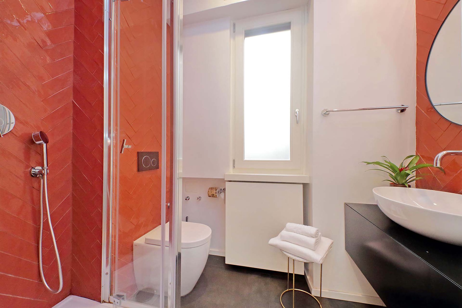 Bathroom 2 features a shower, toilet and sink.